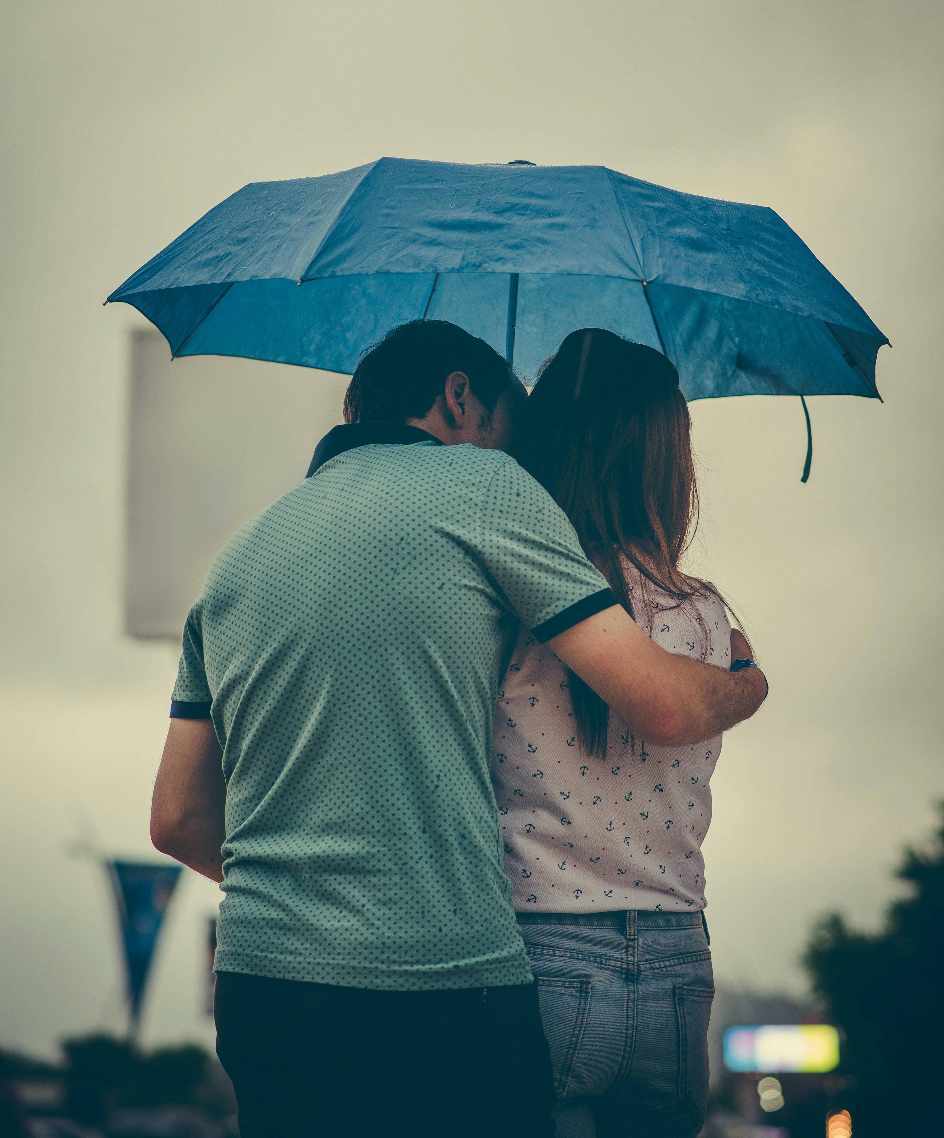Embrace of Love Under an Umbrella — 3000x3616 wallpaper
