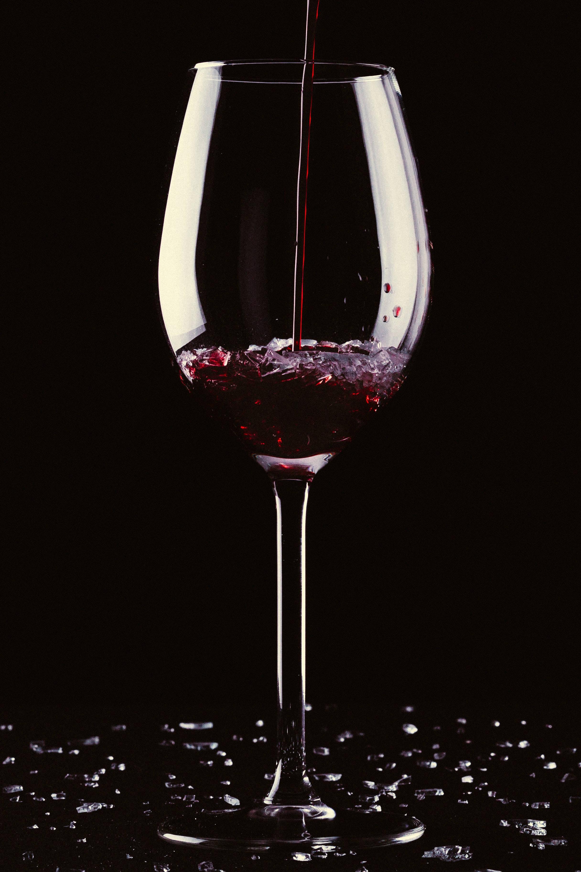 Enjoy a glass of wine while looking out into the darkness — 2432x3648 wallpaper