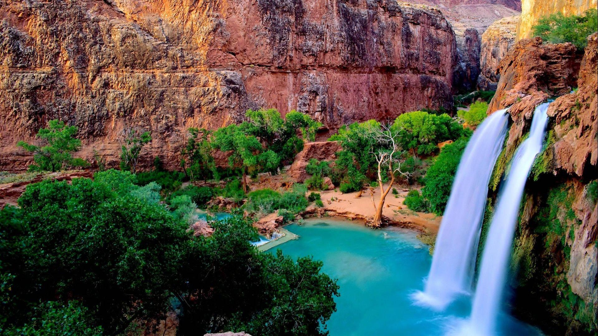 Enjoy the beauty of nature at this striking waterfall — 1920x1080 wallpaper