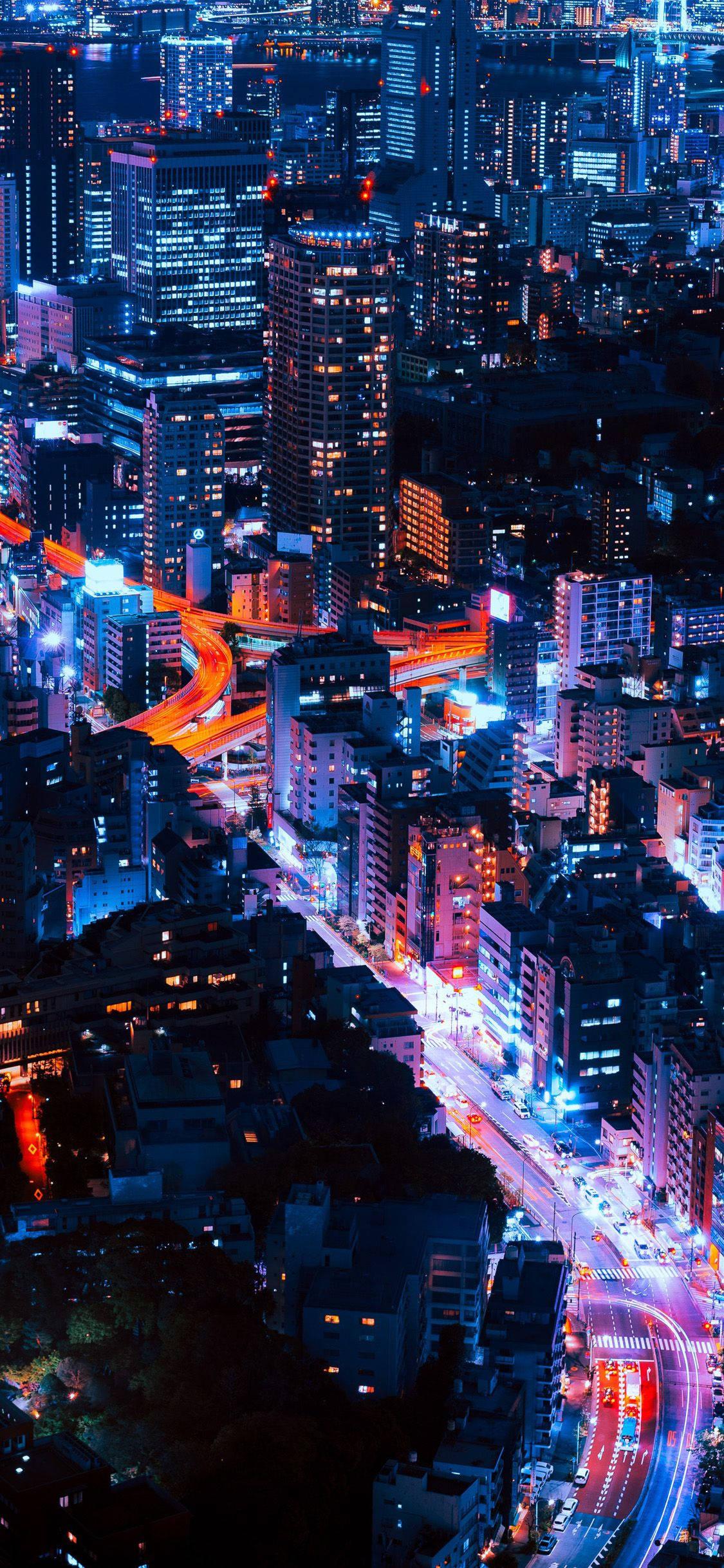 Enjoy your city skyline with the iPhone 11 — 1125x2436 wallpaper