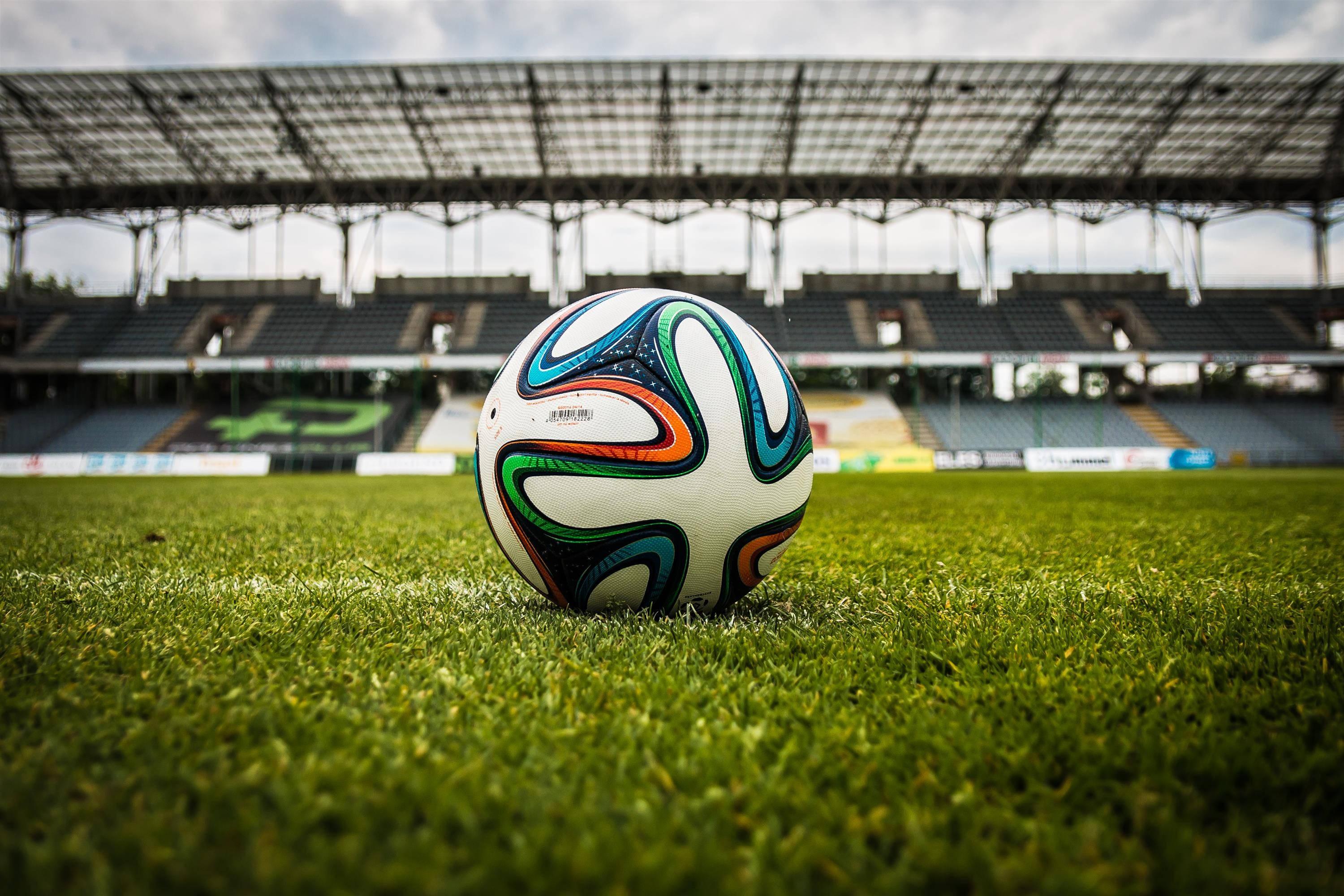 Experience the Thrill of Football in an Exciting Stadium — 3000x2000 wallpaper
