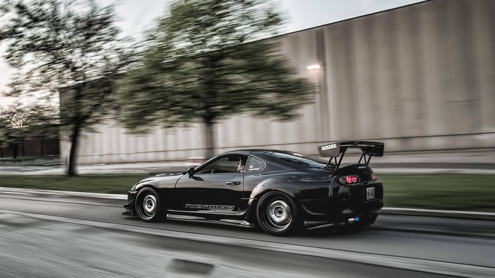 Fast Moving Black Toyota Supra — 1920x1080 wallpaper