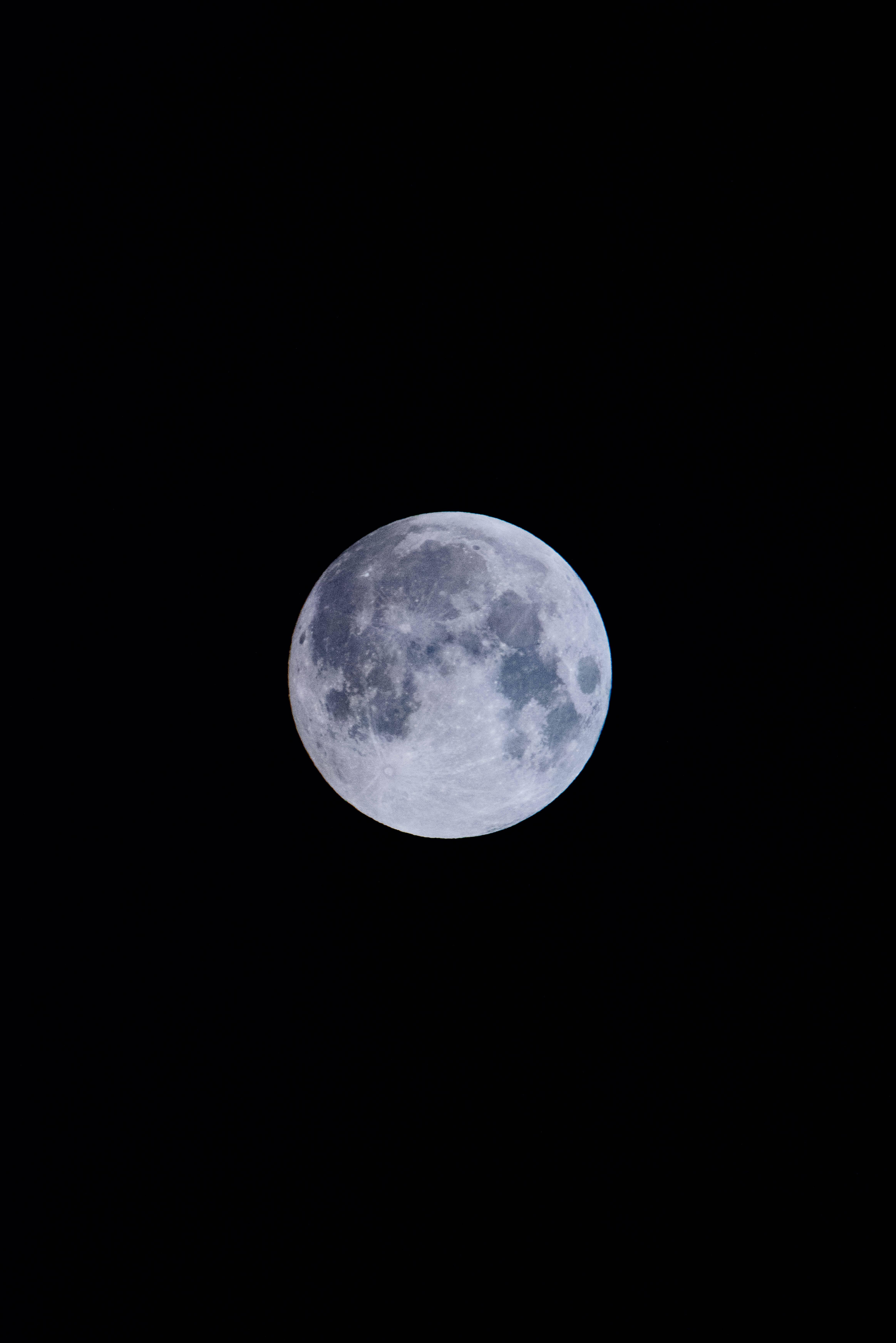 Full moon lighting up the night sky. — 4654x6973 wallpaper
