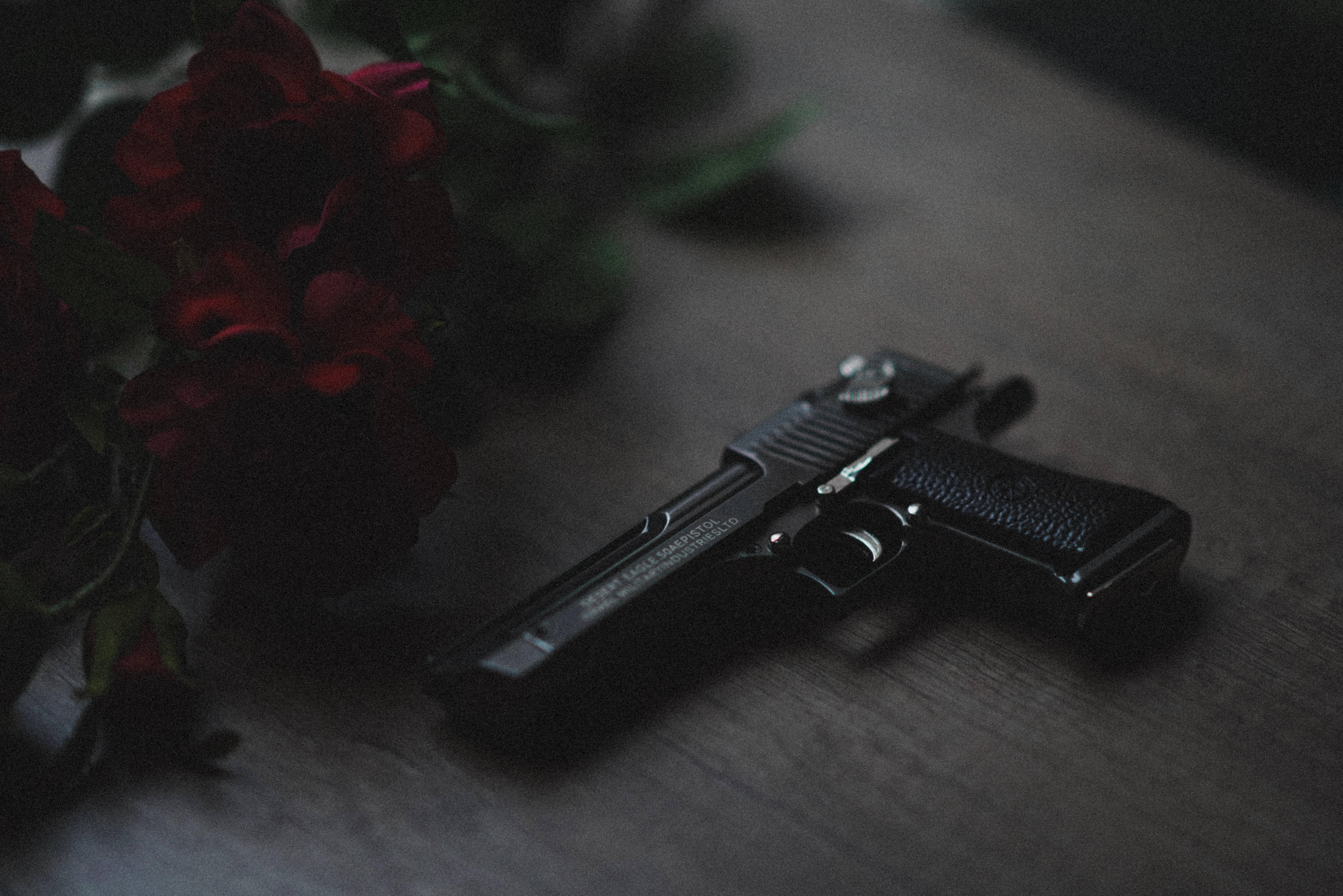 Gun And Red Roses — 7952x5304 wallpaper