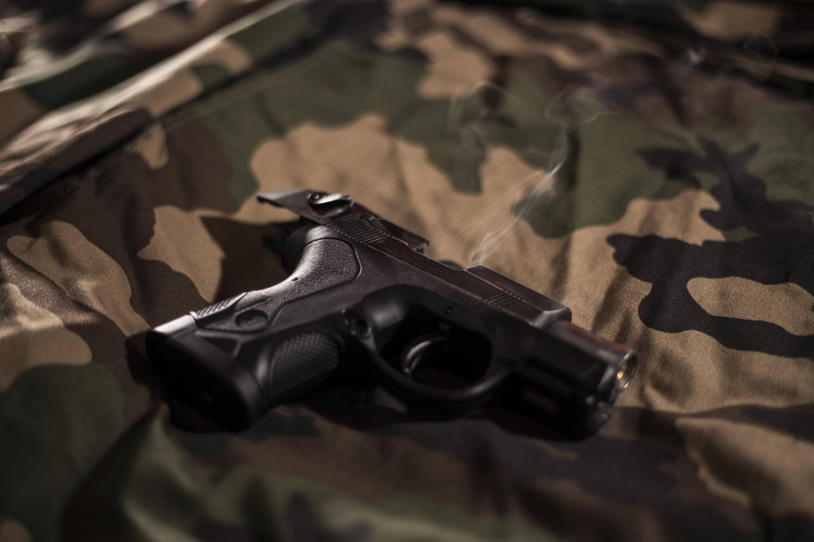 Gun On Camouflage Sheet — 2736x1824 wallpaper