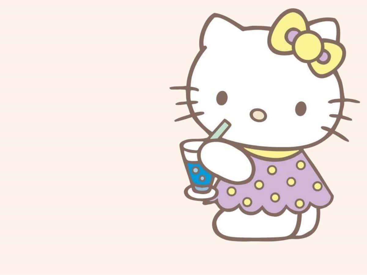 Hello Kitty Laptop Sipping Drink — 1200x900 wallpaper