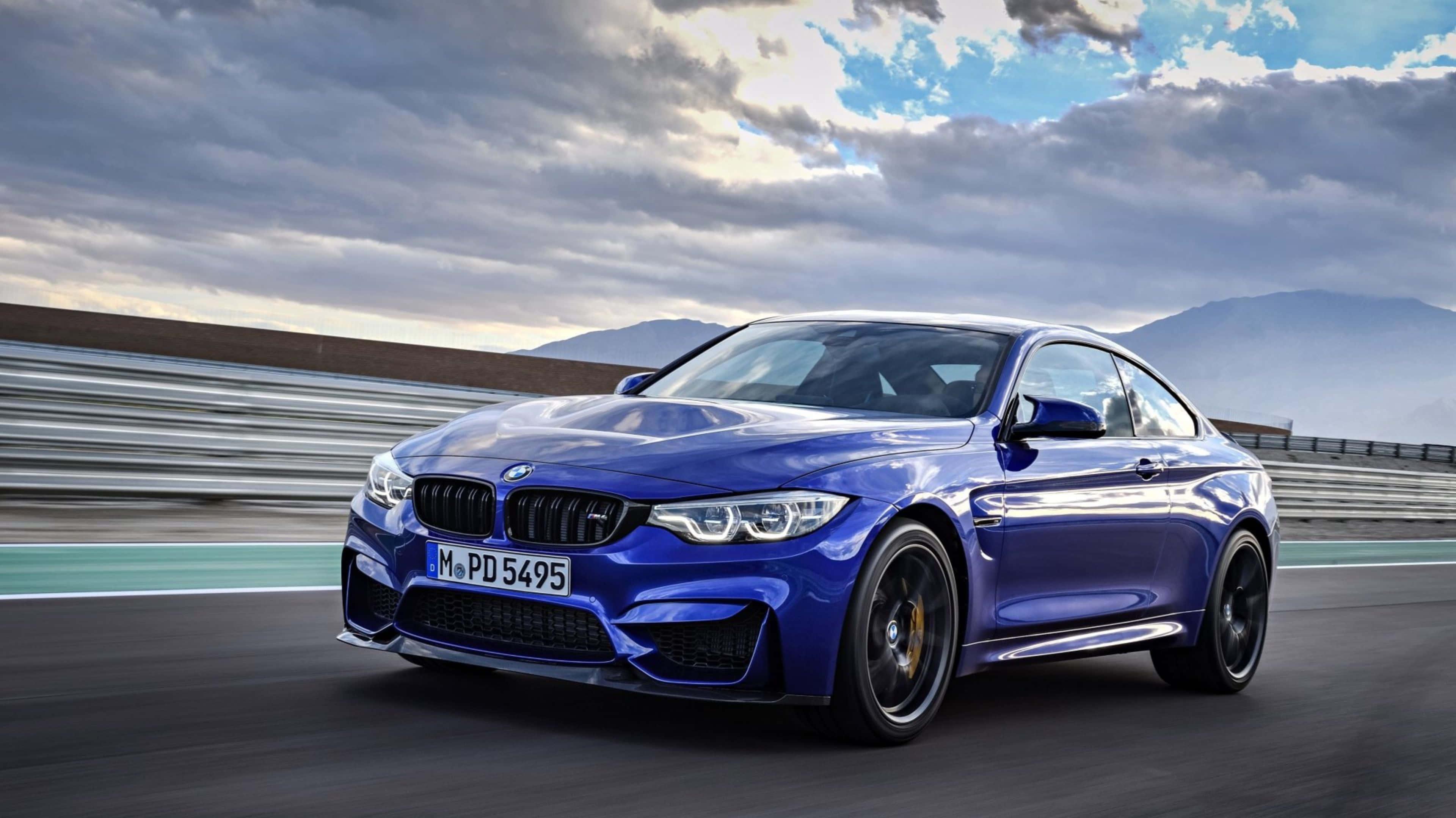 Image "An all black BMW 4k, sitting in a stunning red canyon." — 3840x2160 wallpaper