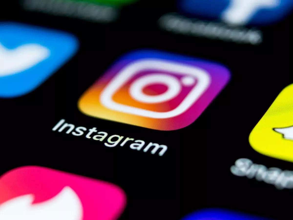 instagram logos are displayed on a smartphone — 1200x900 wallpaper