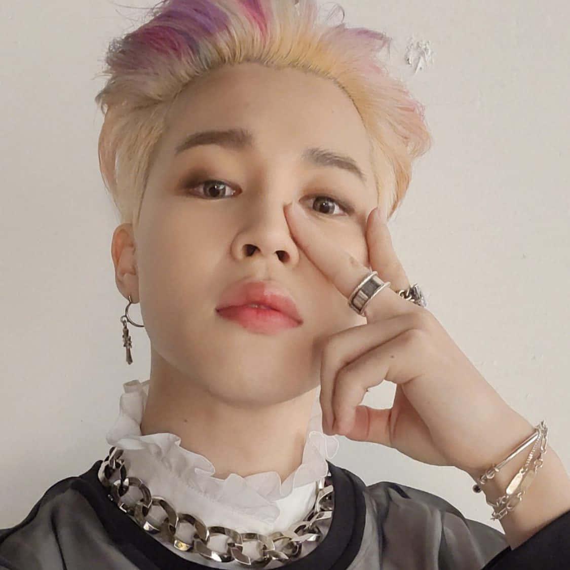 Jimin of the popular South Korean boy band BTS posing for photos. — 1125x1125 wallpaper
