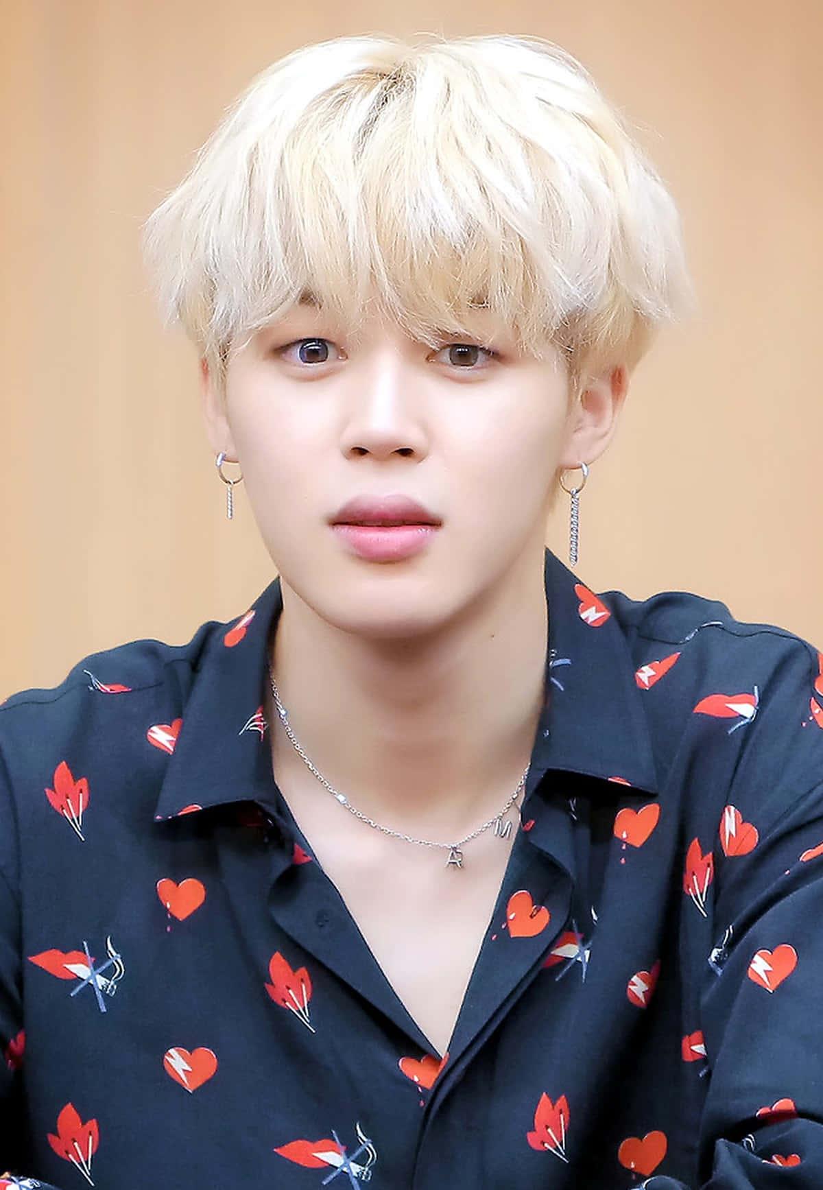 Jimin takes center stage with a captivating performance. — 1200x1735 wallpaper