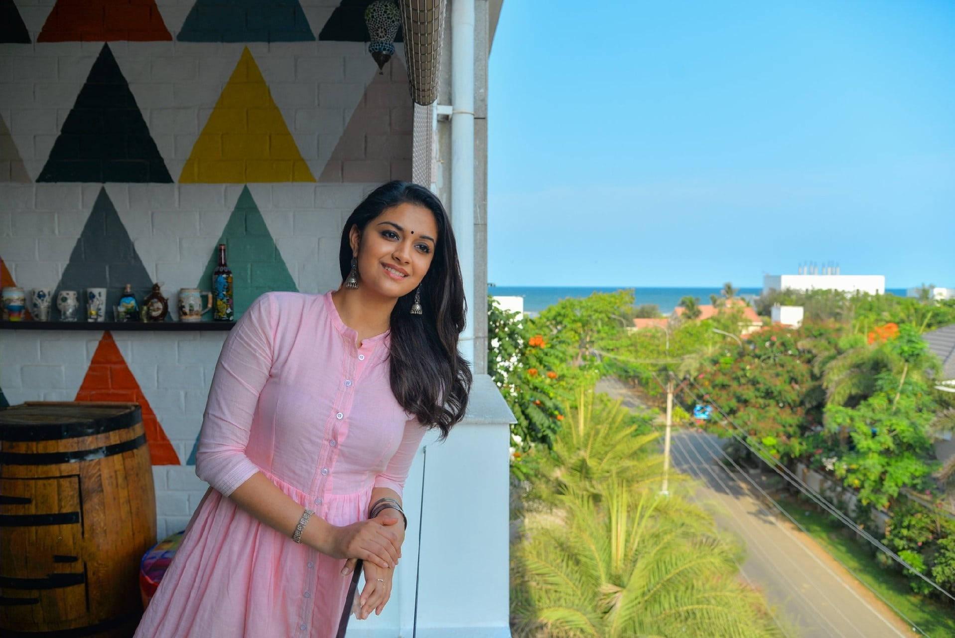 Keerthi Suresh Leaning Out A Window — 1917x1280 wallpaper