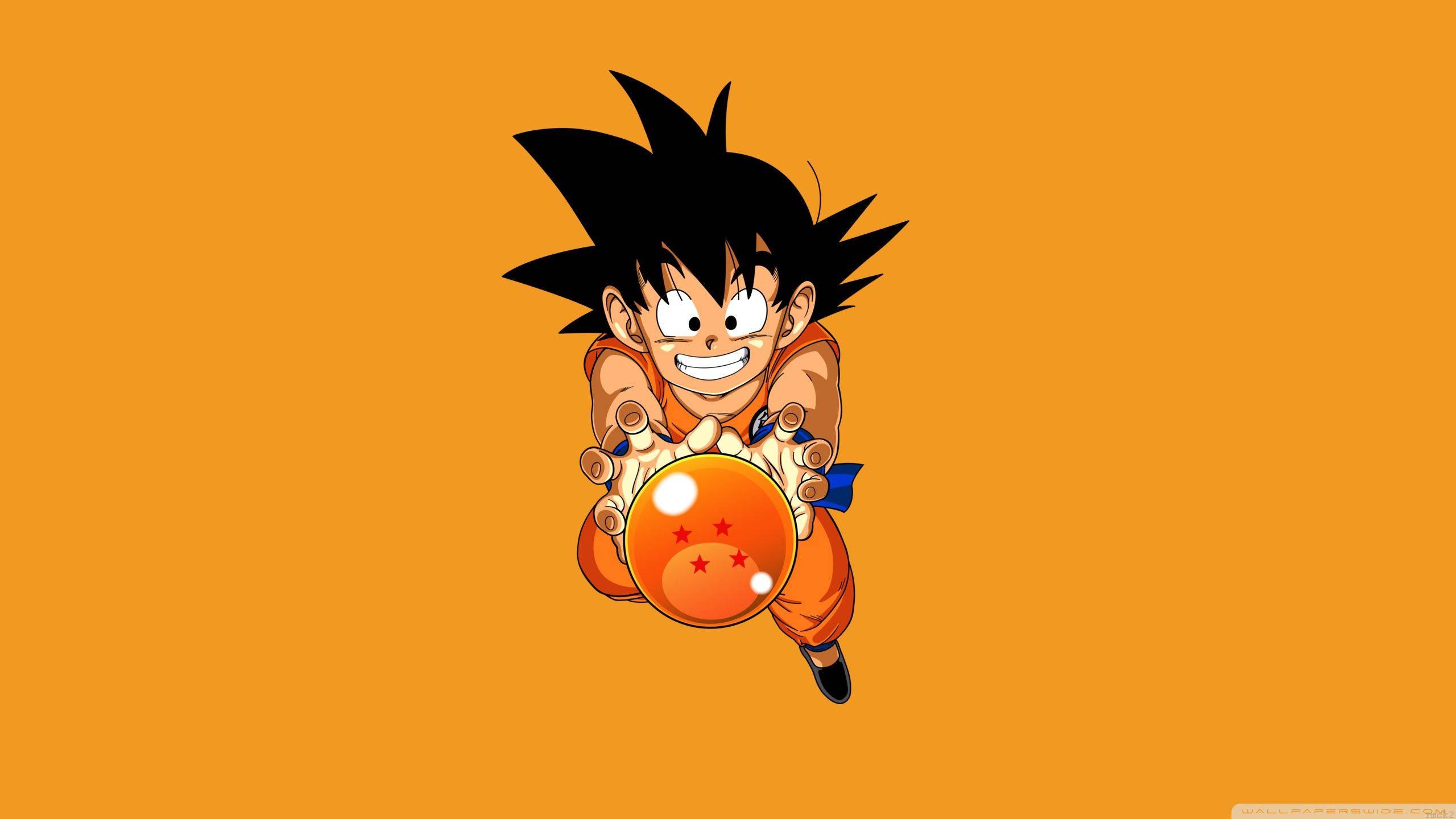 "Kid Goku proudly holding the 4-star dragon ball"