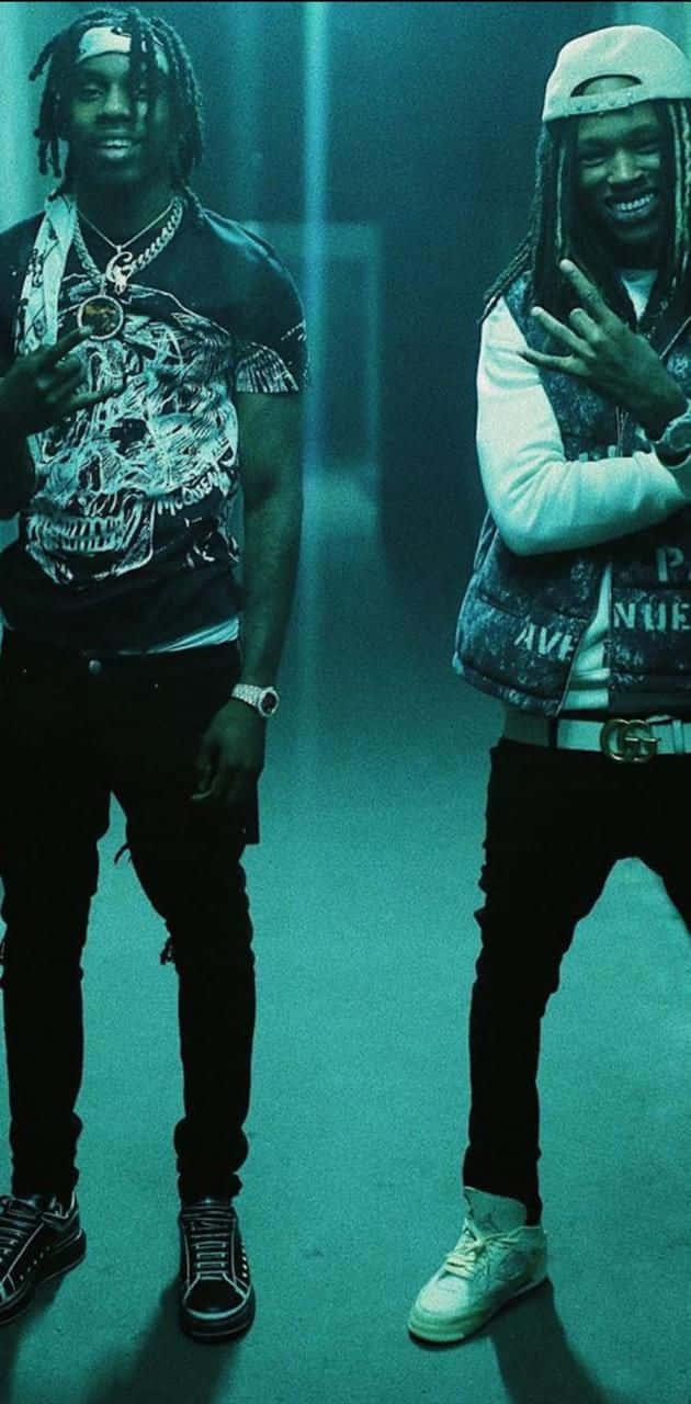 King Von striking a pose in the streets of Chicago — 630x1280 wallpaper