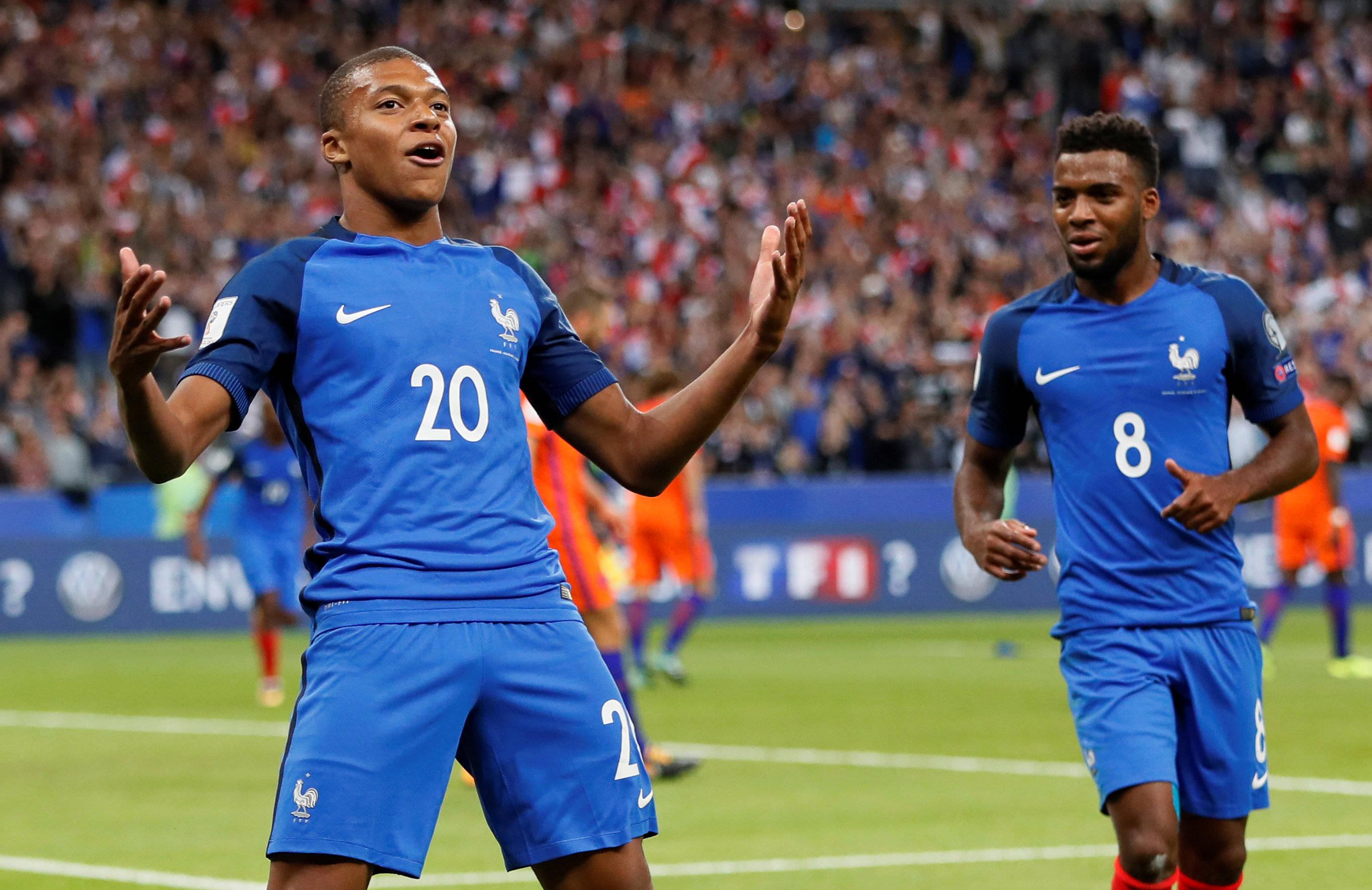 Kylian Mbappe Confident Open Arms Pose — 2719x1763 wallpaper