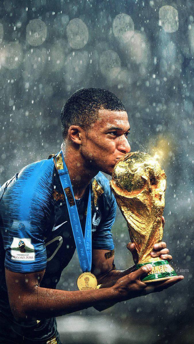 Kylian Mbappe Kissing World Cup Trophy — 675x1200 wallpaper