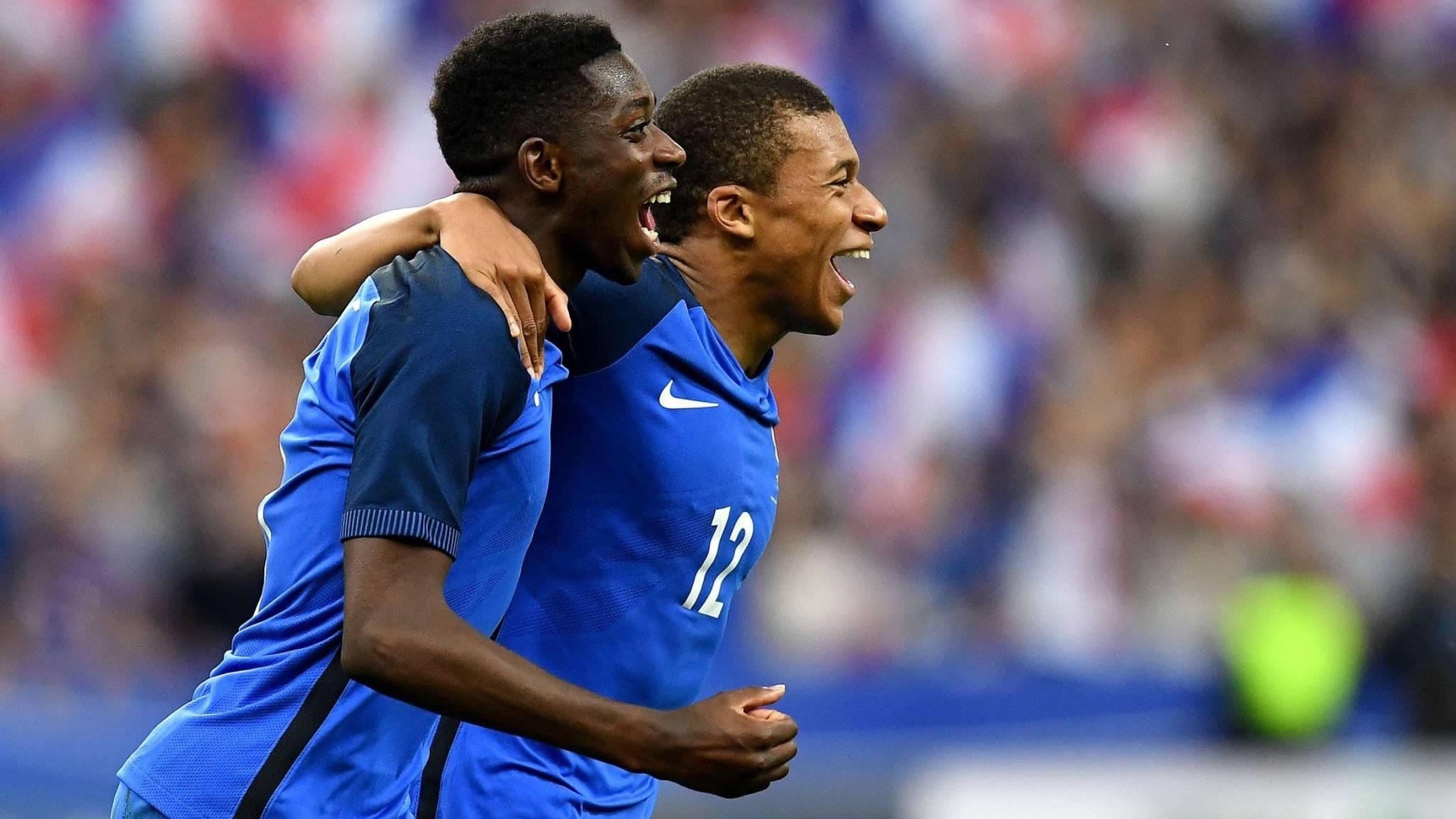 Kylian Mbappe Side-Hugging Teammate — 2048x1152 wallpaper
