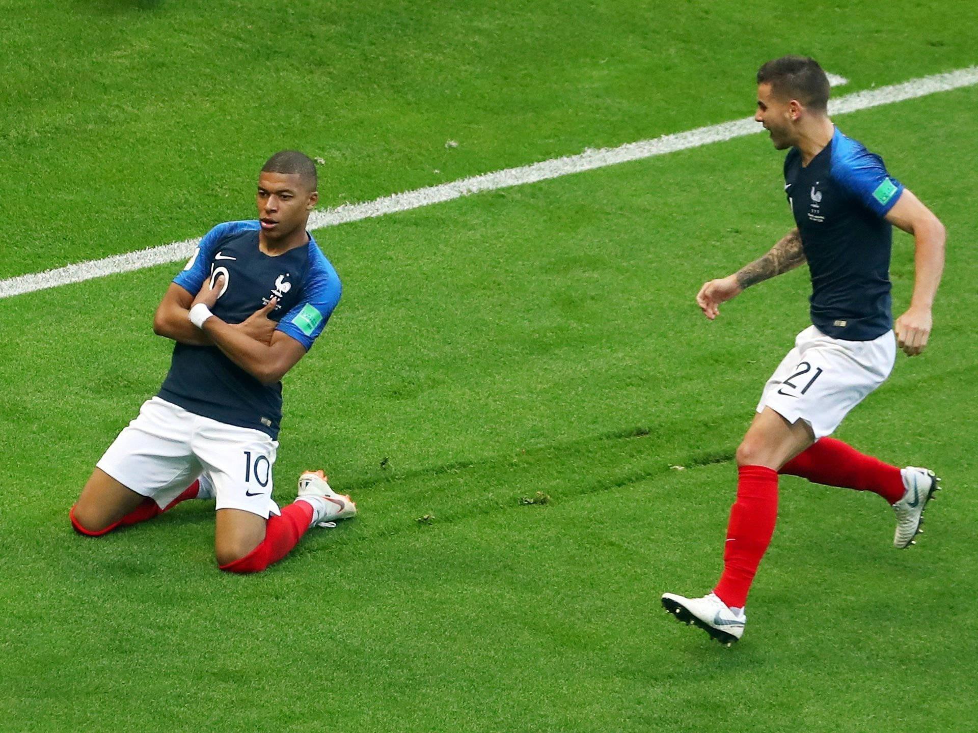 Kylian Mbappe Smug Kneeling Pose — 1920x1440 wallpaper