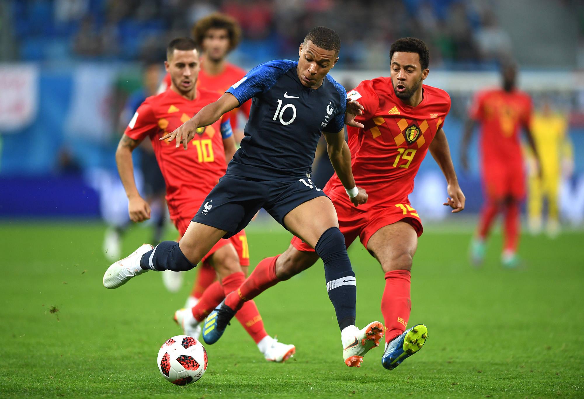 Kylian Mbappe - Striking the Ball with Precision — 2000x1367 wallpaper