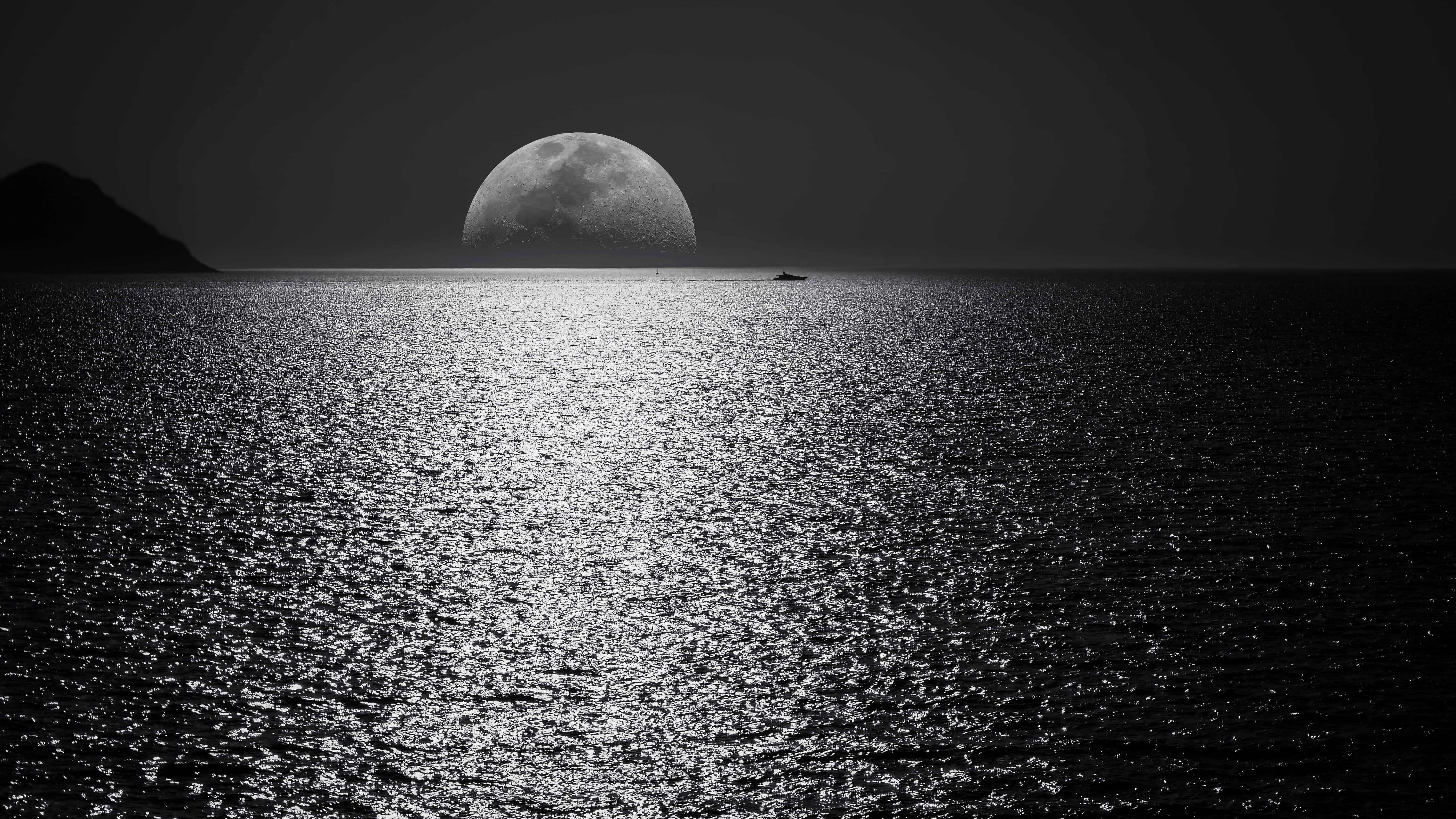 Laptop with a breathtaking nocturnal sea view and moon on display — 4938x2778 wallpaper