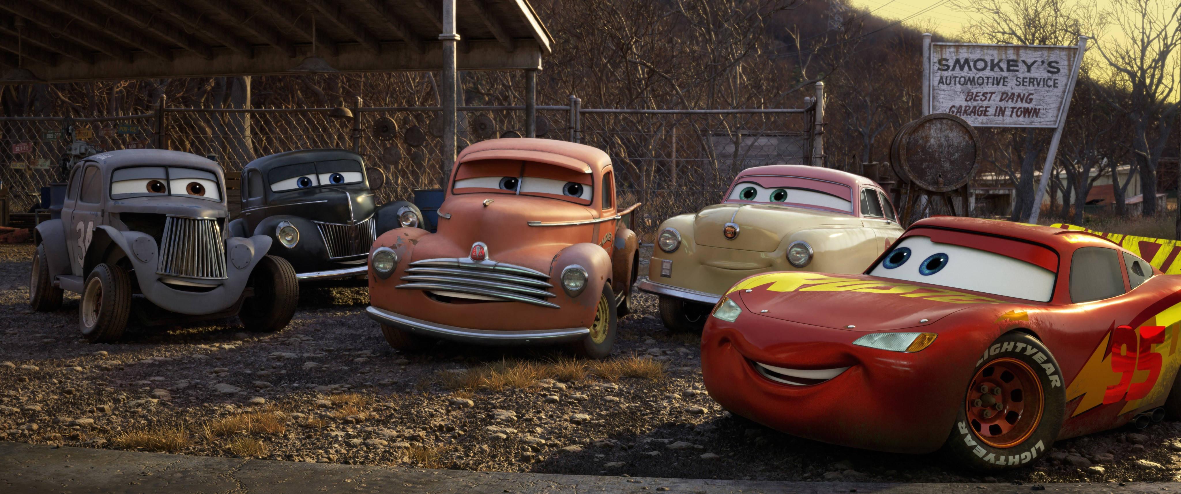 Lightning McQueen zooming on the racetrack — 4096x1715 wallpaper