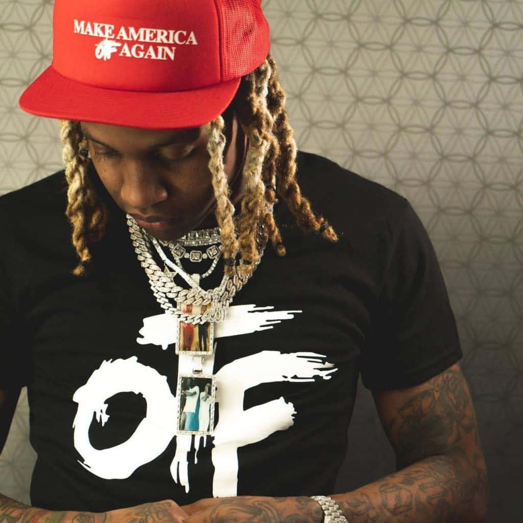 Lil Durk striking a pose in a stylish outfit — 1024x1024 wallpaper