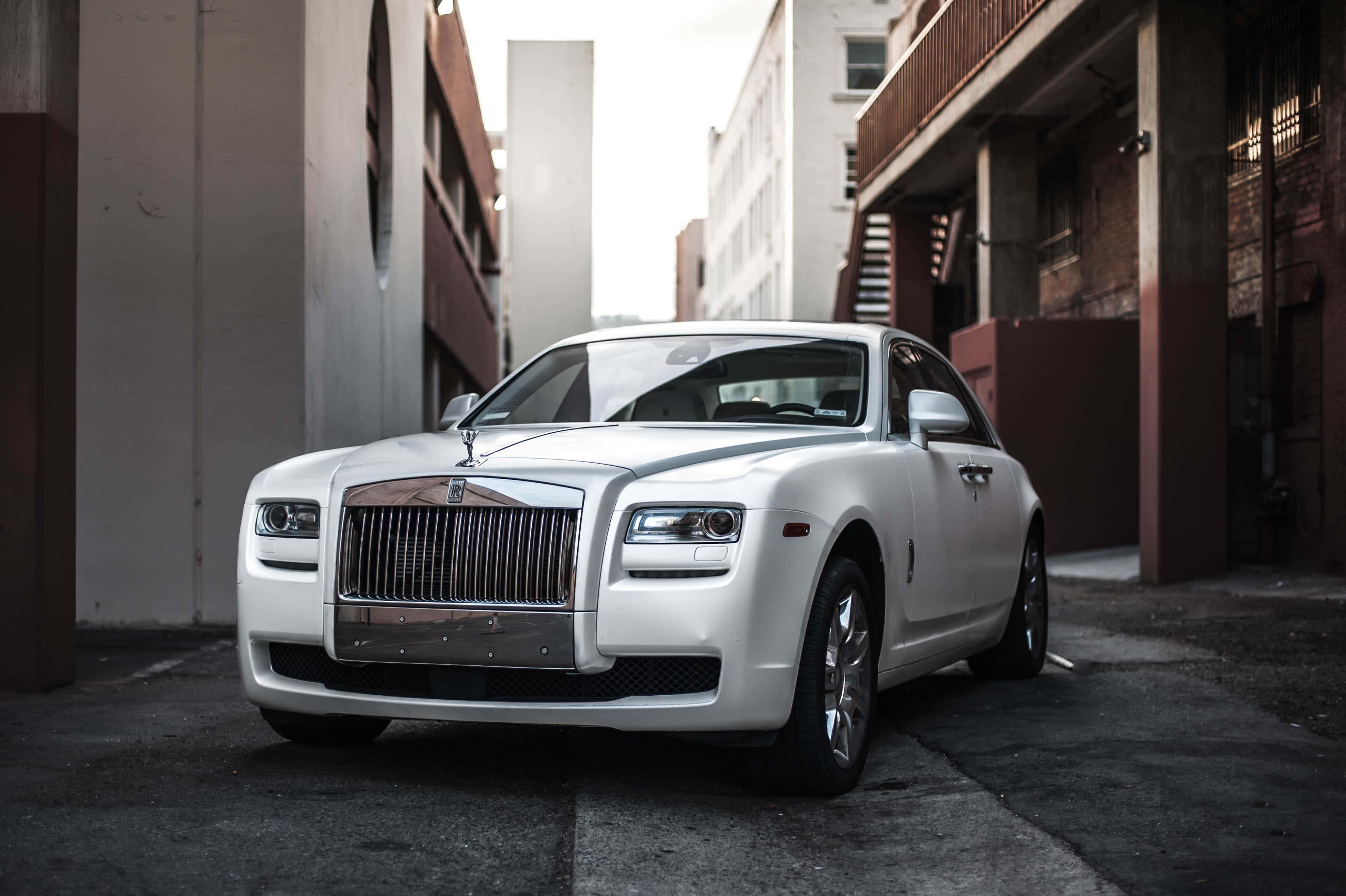 Luxurious Rolls Royce parked amidst an enchanting natural landscape. — 3952x2630 wallpaper
