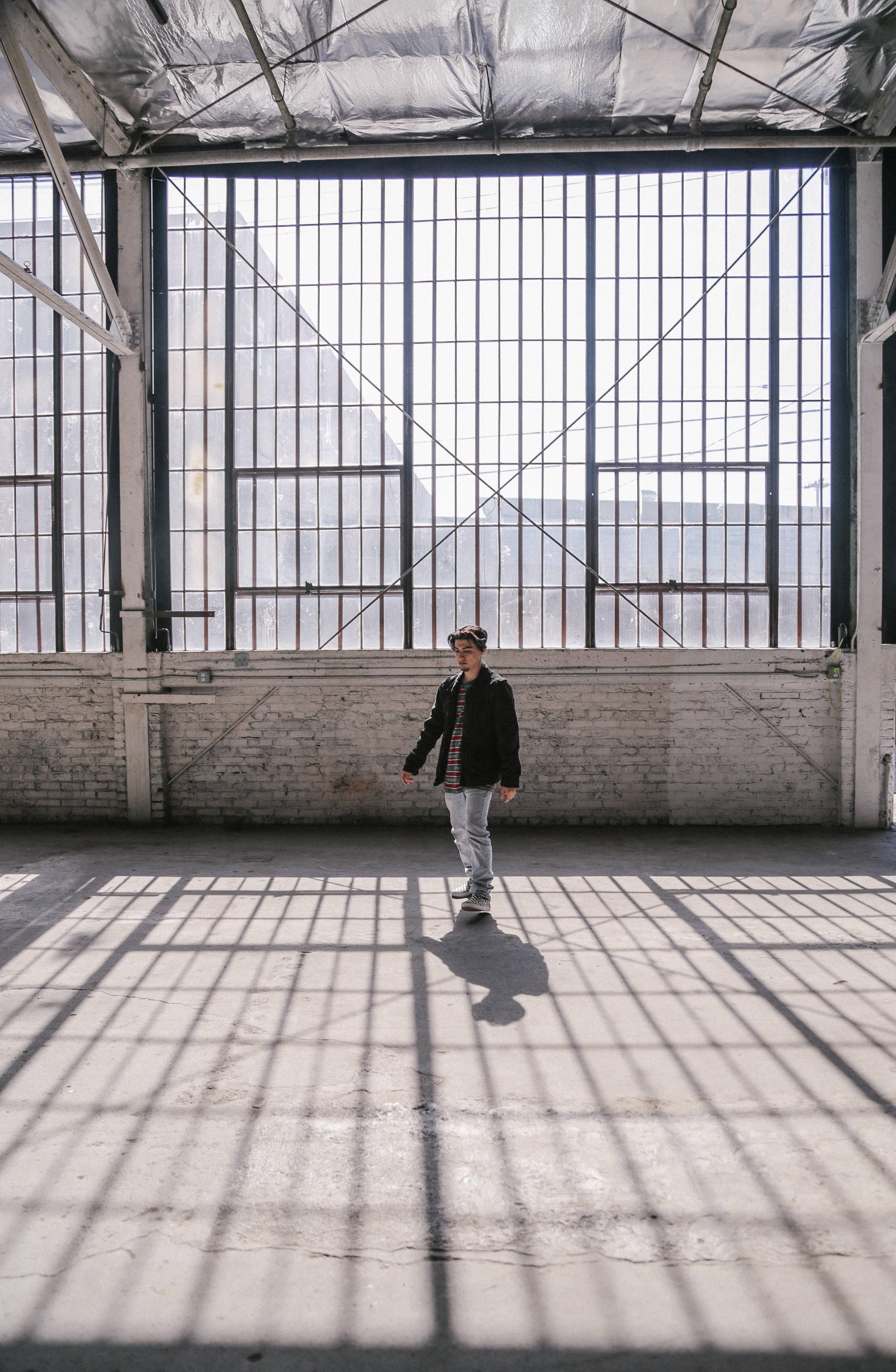 Man Wearing Black Zip-up Jacket Inside Gray House — 2854x4368 wallpaper