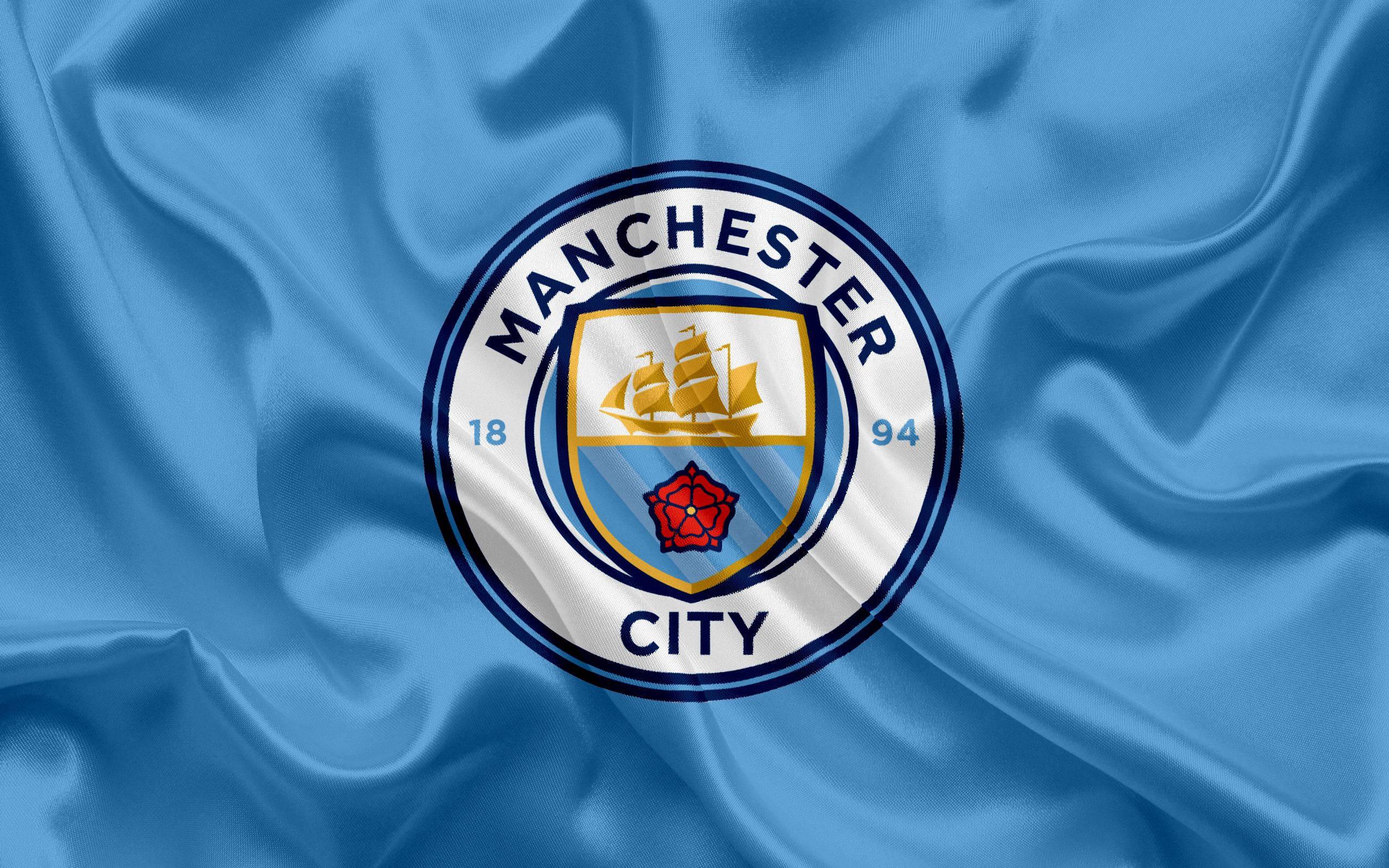 Manchester City's Official Logo and Flag — 2560x1600 wallpaper