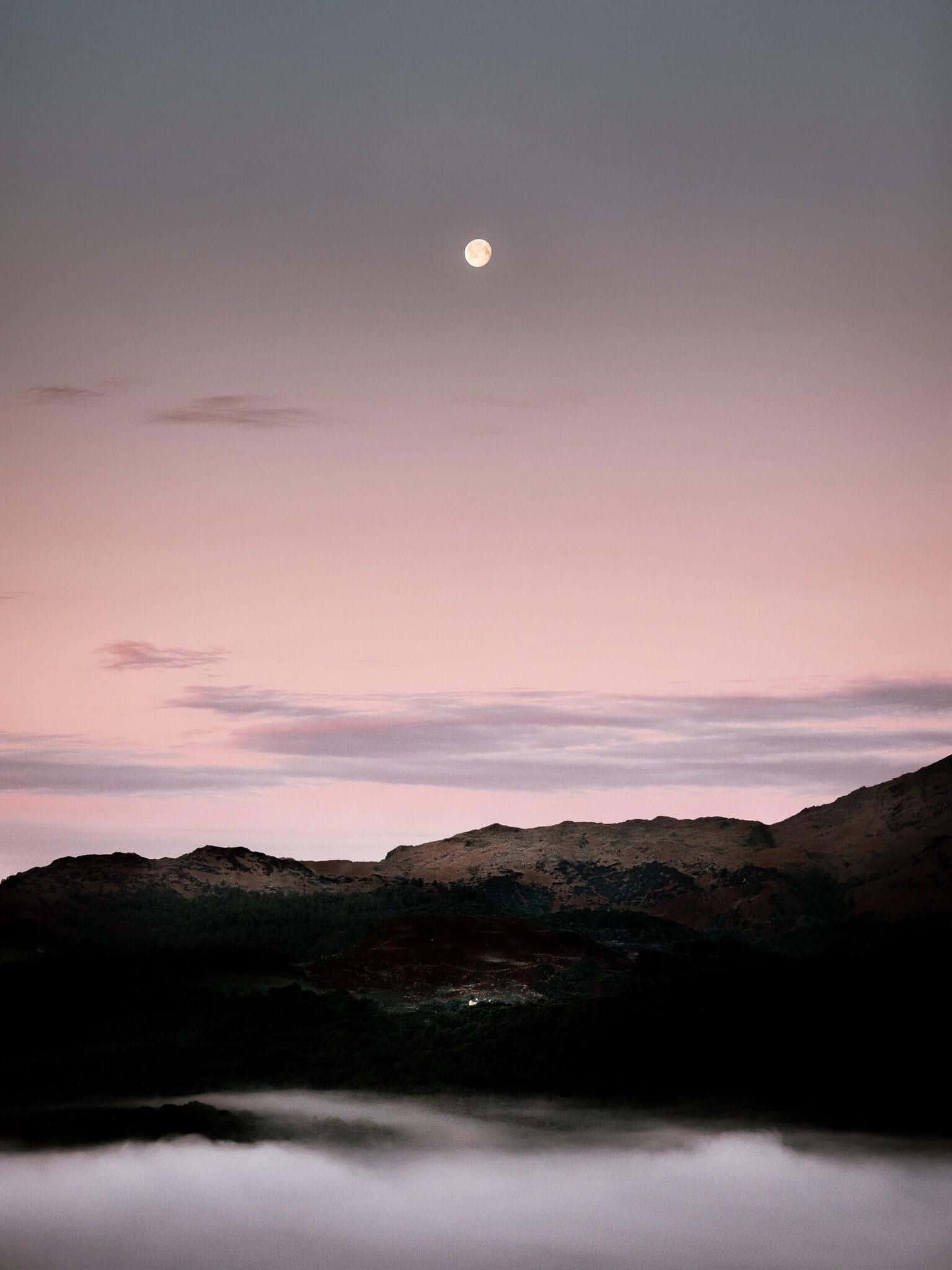 moon rising over a lake with fog — 1536x2048 wallpaper