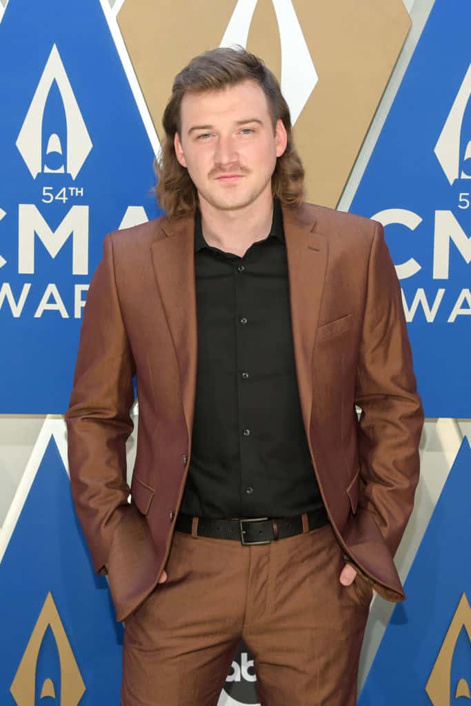 Morgan Wallen singing his hit single "Whiskey Glasses" on the Grand Ole Opry — 683x1024 wallpaper