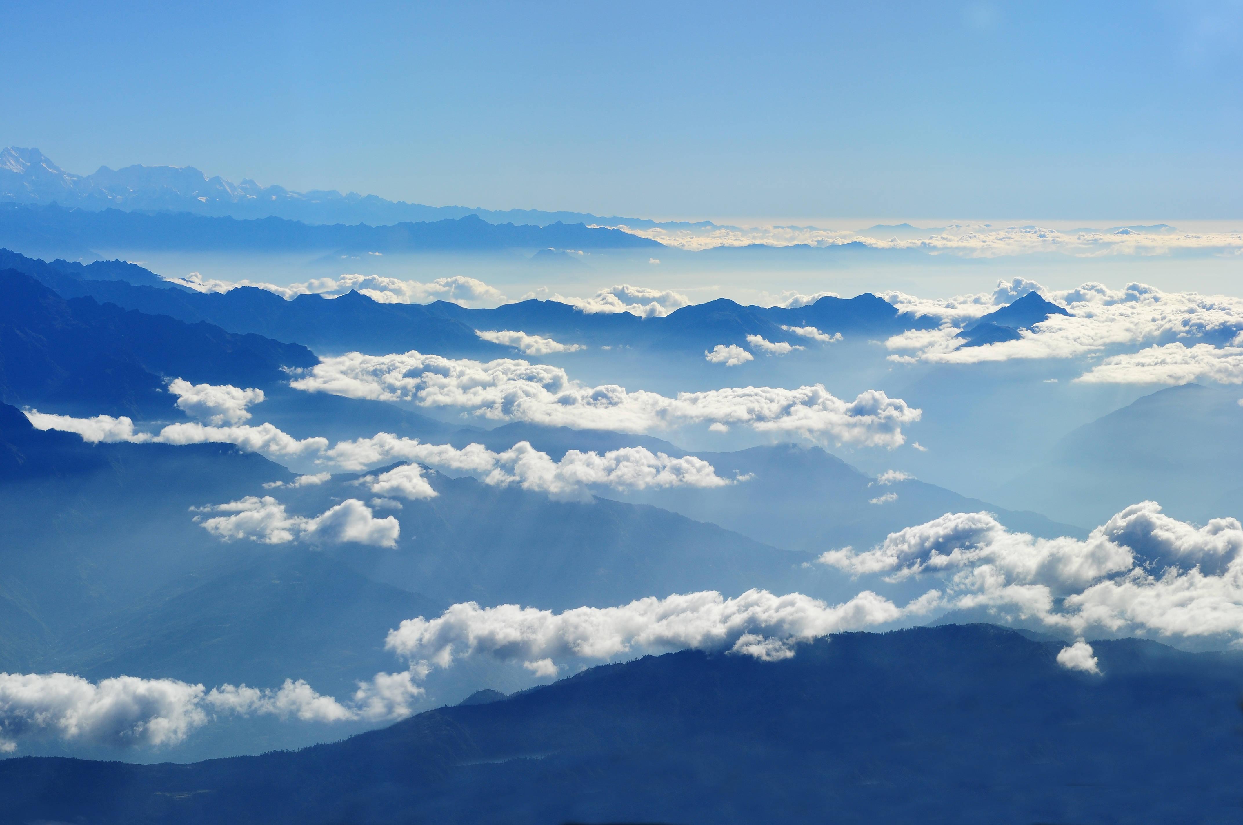 Mountains Reaching Into a Cloudy Sky — 4288x2848 wallpaper