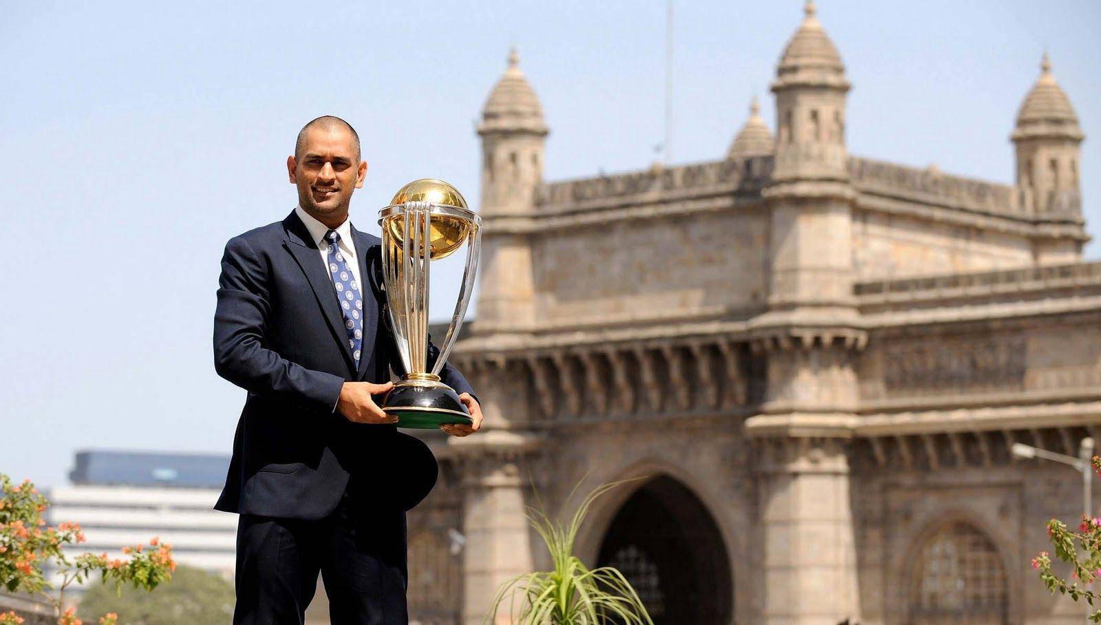 Ms Dhoni With Golden Championship Trophy — 1600x908 wallpaper
