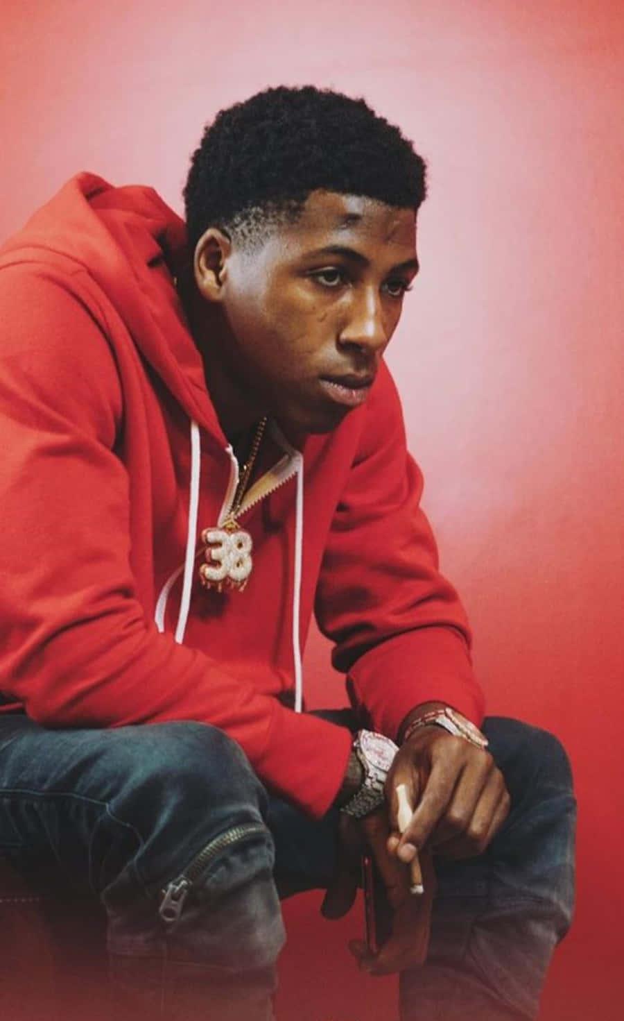 NBA Youngboy Celebrating Stage Performance — 900x1471 wallpaper