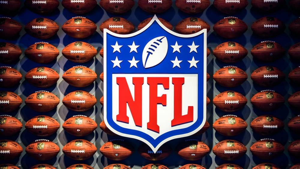 NFL Logo With Footballs — 1000x563 wallpaper