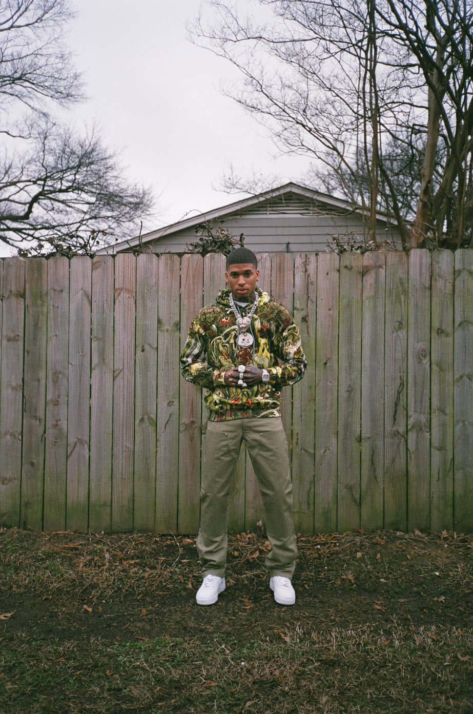 NLE Choppa striking a powerful pose — 923x1393 wallpaper