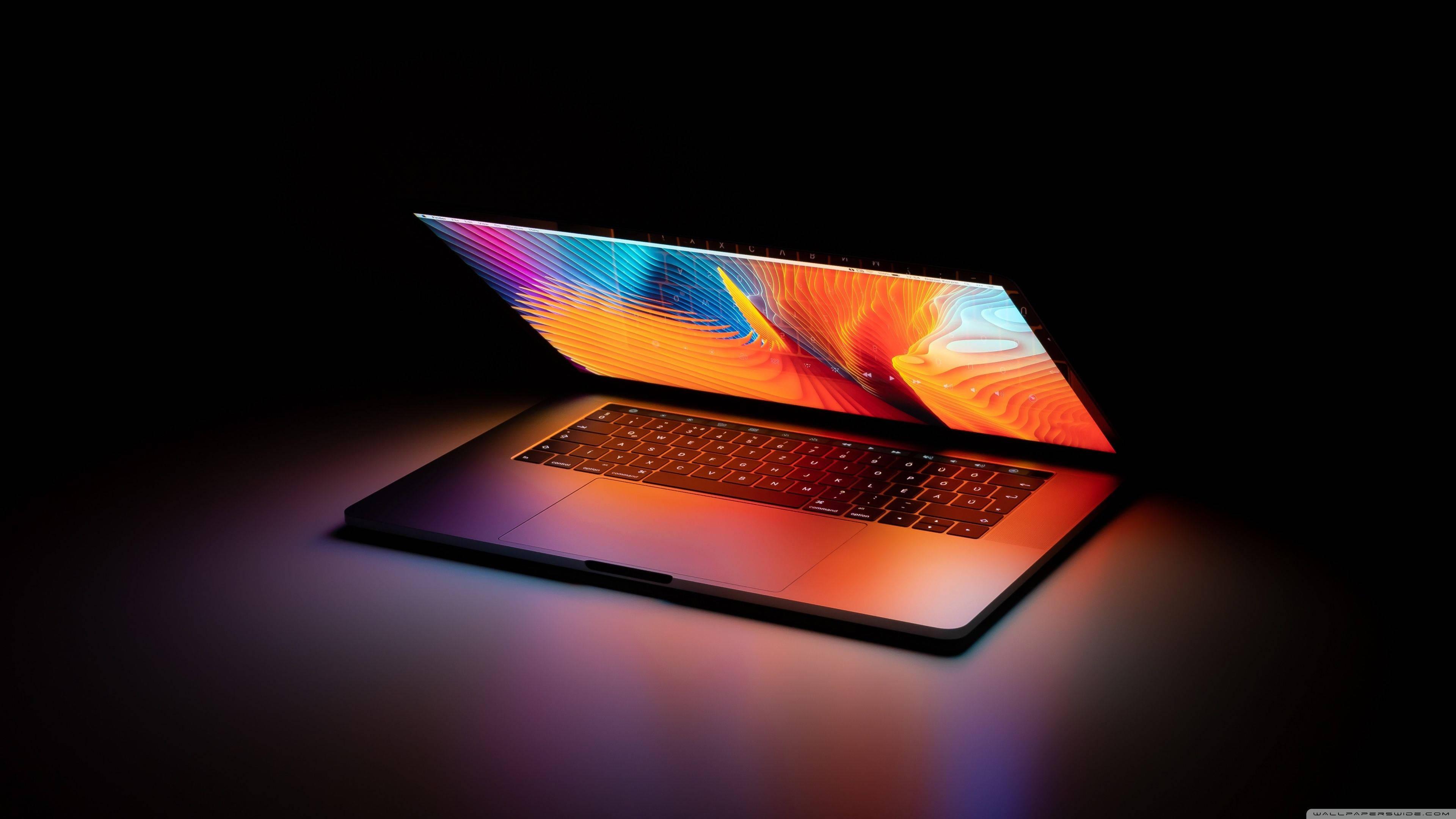 Open Laptop In Dark — 3840x2160 wallpaper
