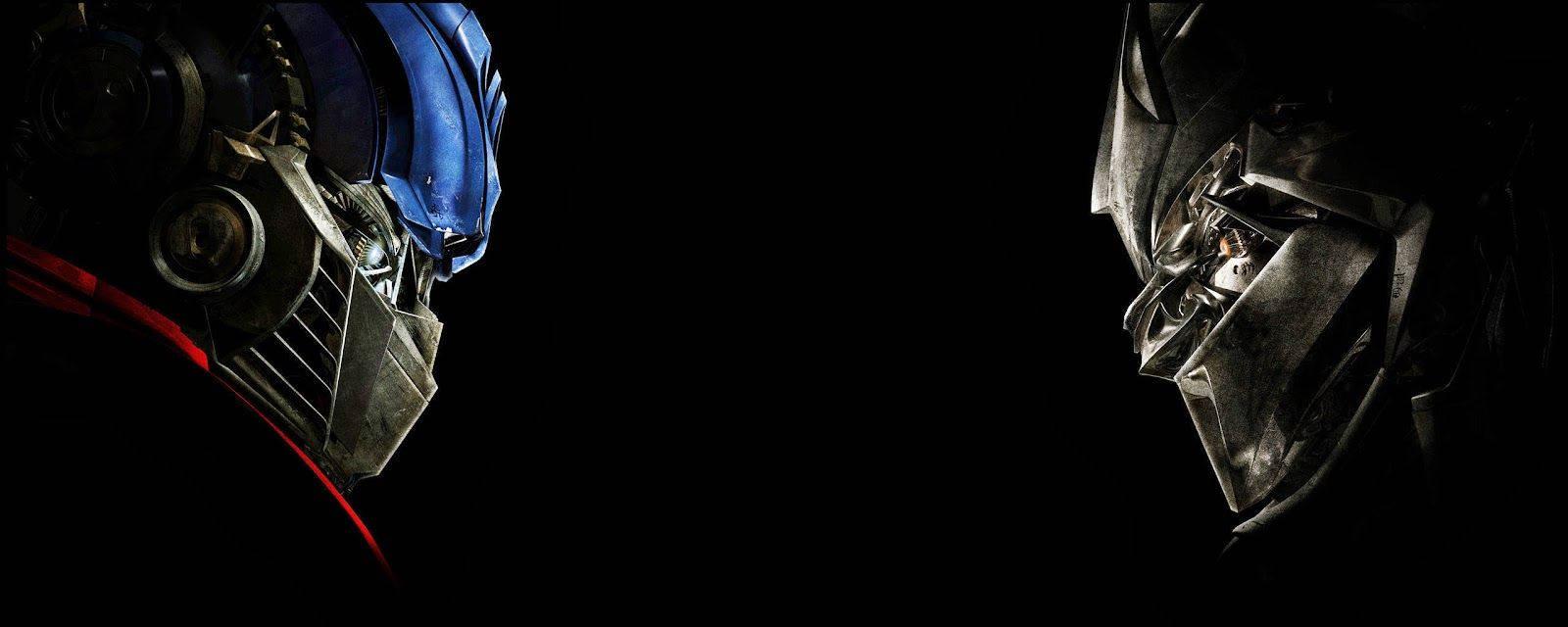 Optimus Prime and Megatron locked in epic battle — 1600x640 wallpaper