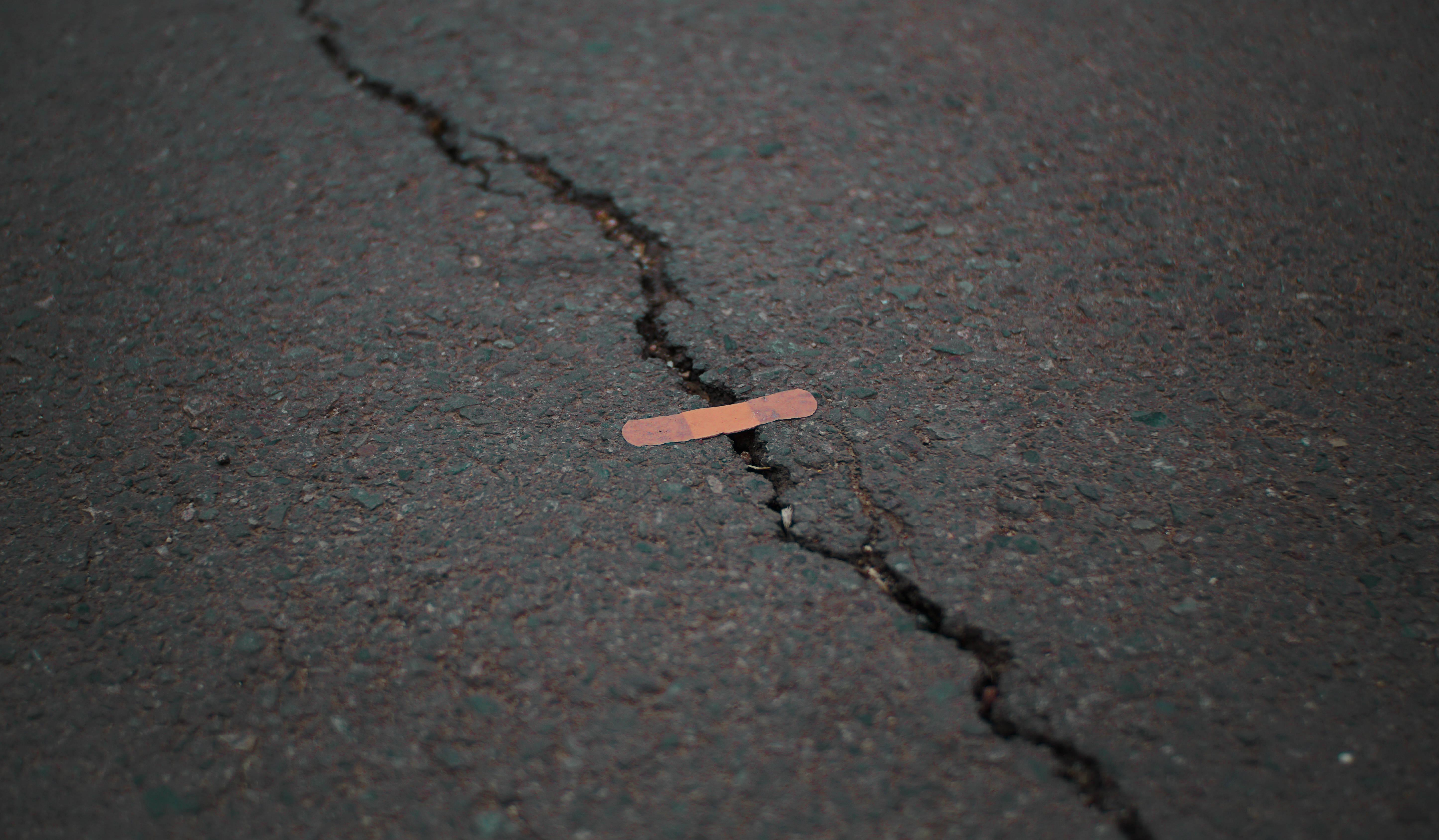 Orange Band Aid On Concrete Surface Crack — 5781x3376 wallpaper