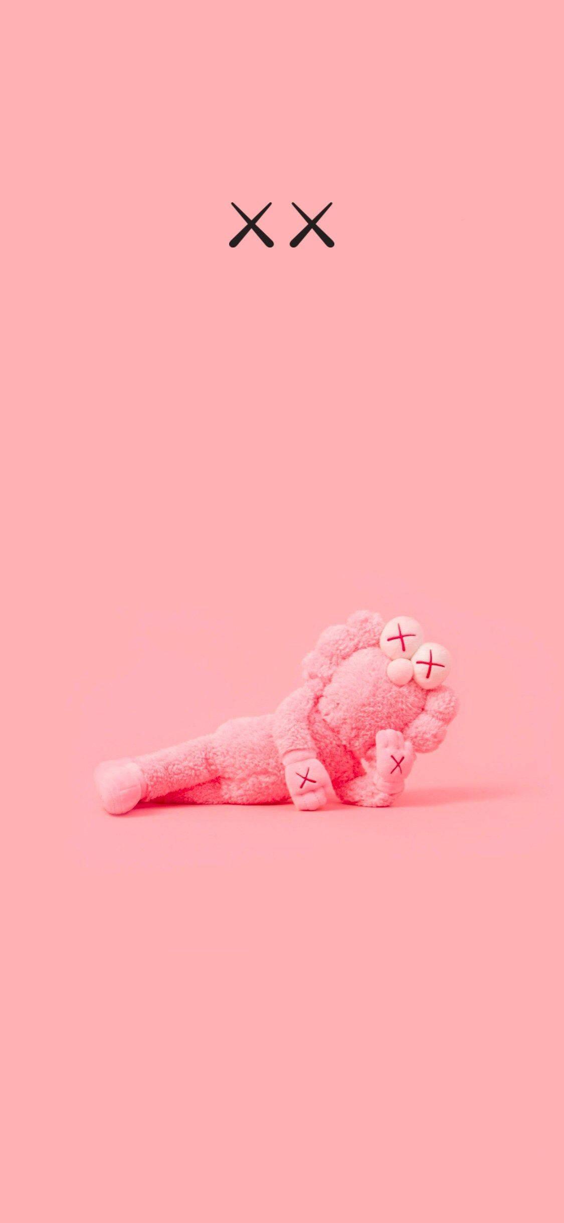 Pink BFF KAWS Figure — 1125x2436 wallpaper