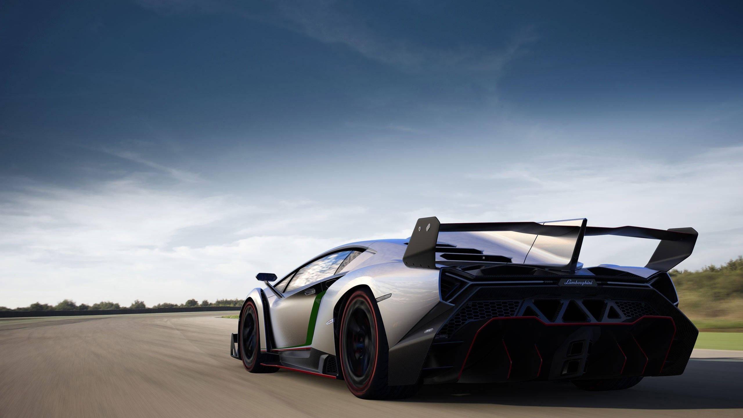 Power and Luxury Redefined - Black Lamborghini — 2560x1440 wallpaper