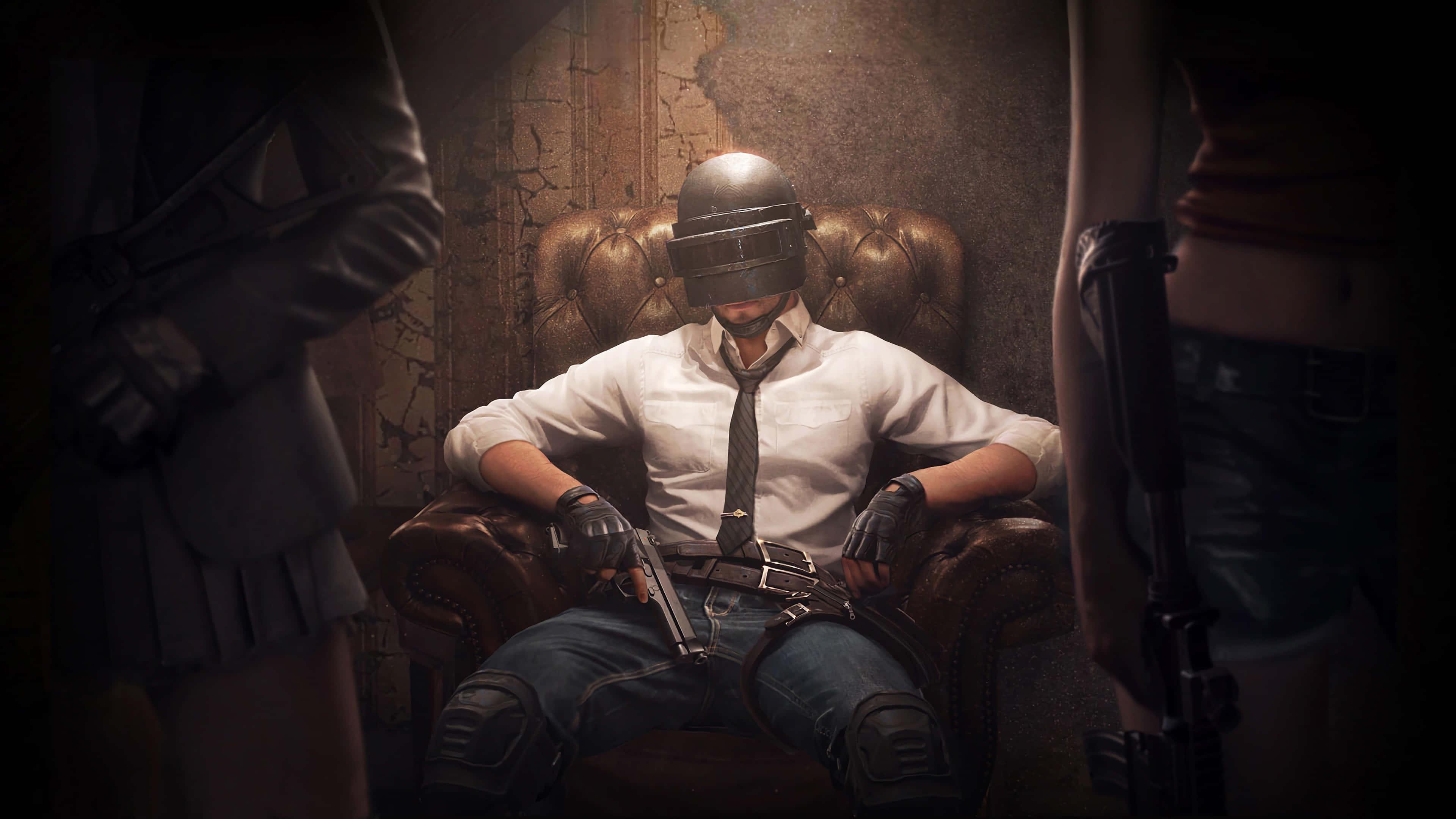 pubg mobile - a man sitting in a chair with guns — 3840x2160 wallpaper