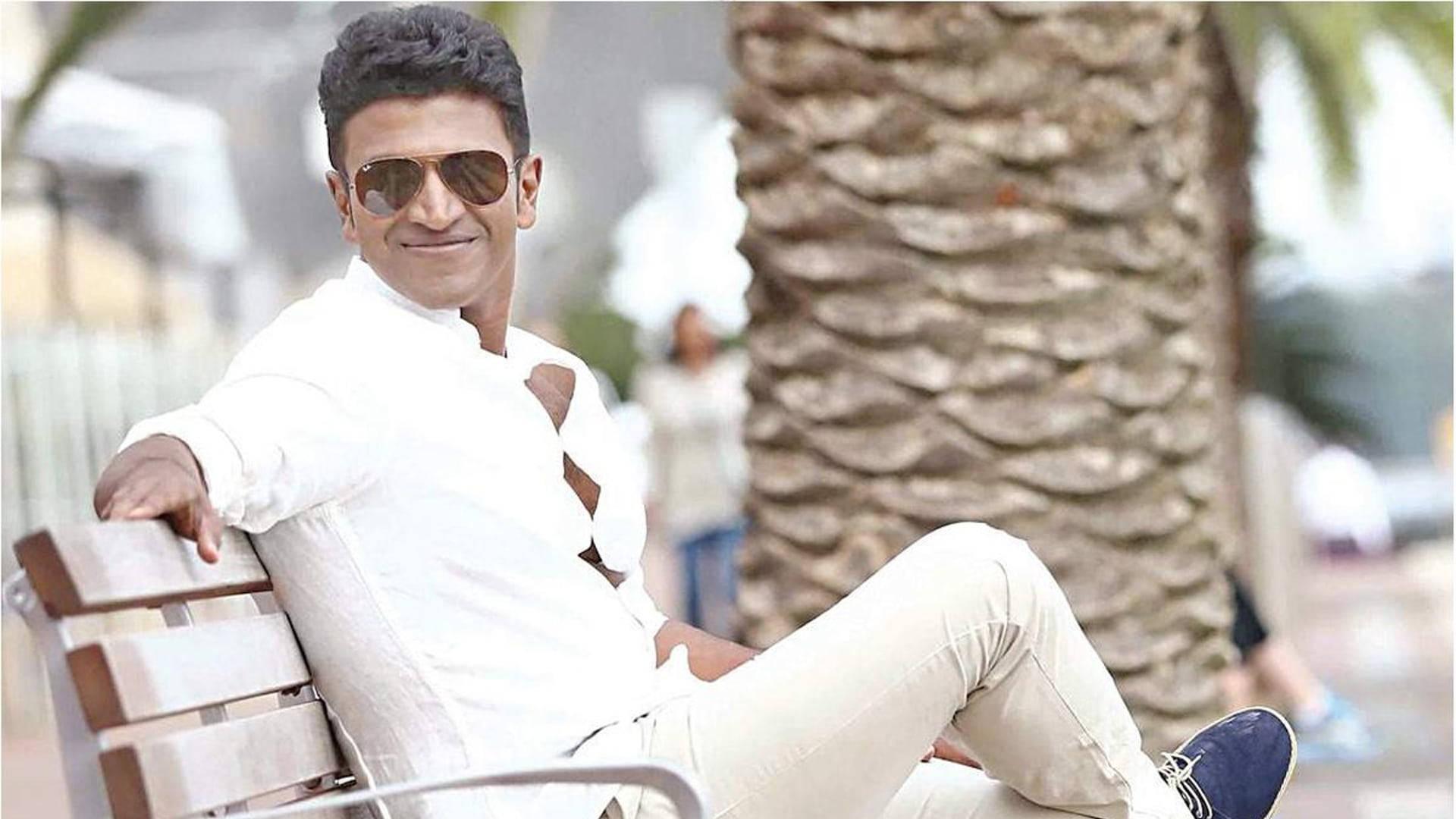 Puneeth Rajkumar On Bench — 1920x1080 wallpaper