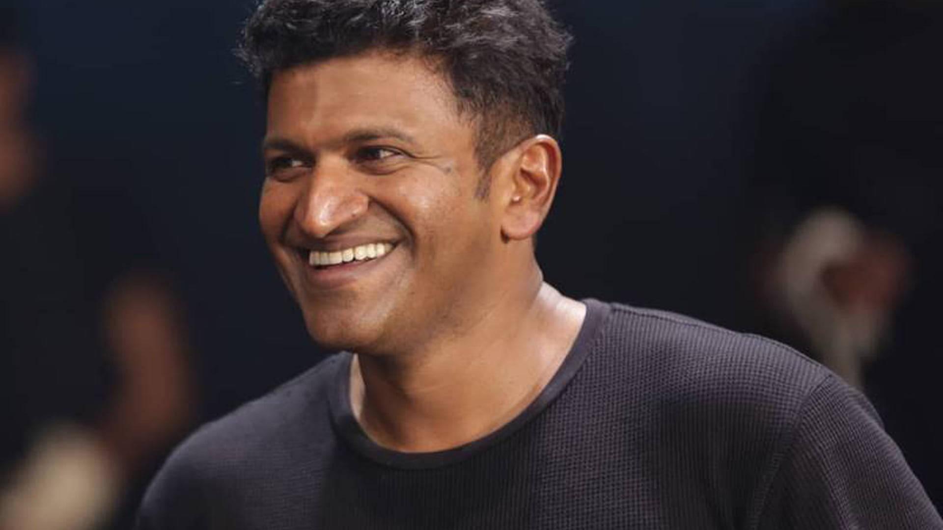 Puneeth Rajkumar Smiling — 1920x1080 wallpaper