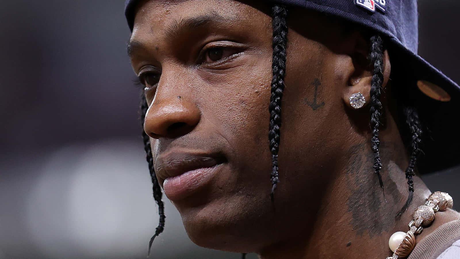 Rapper and singer Travis Scott performing during a concert. — 1600x900 wallpaper