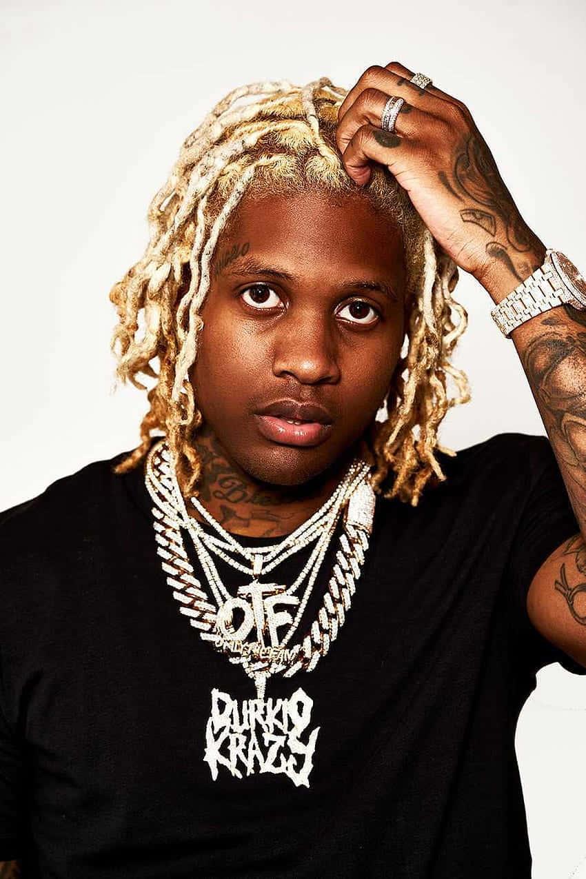 Rapper_with_ Blond_ Dreads_and_ Chains — 850x1275 wallpaper