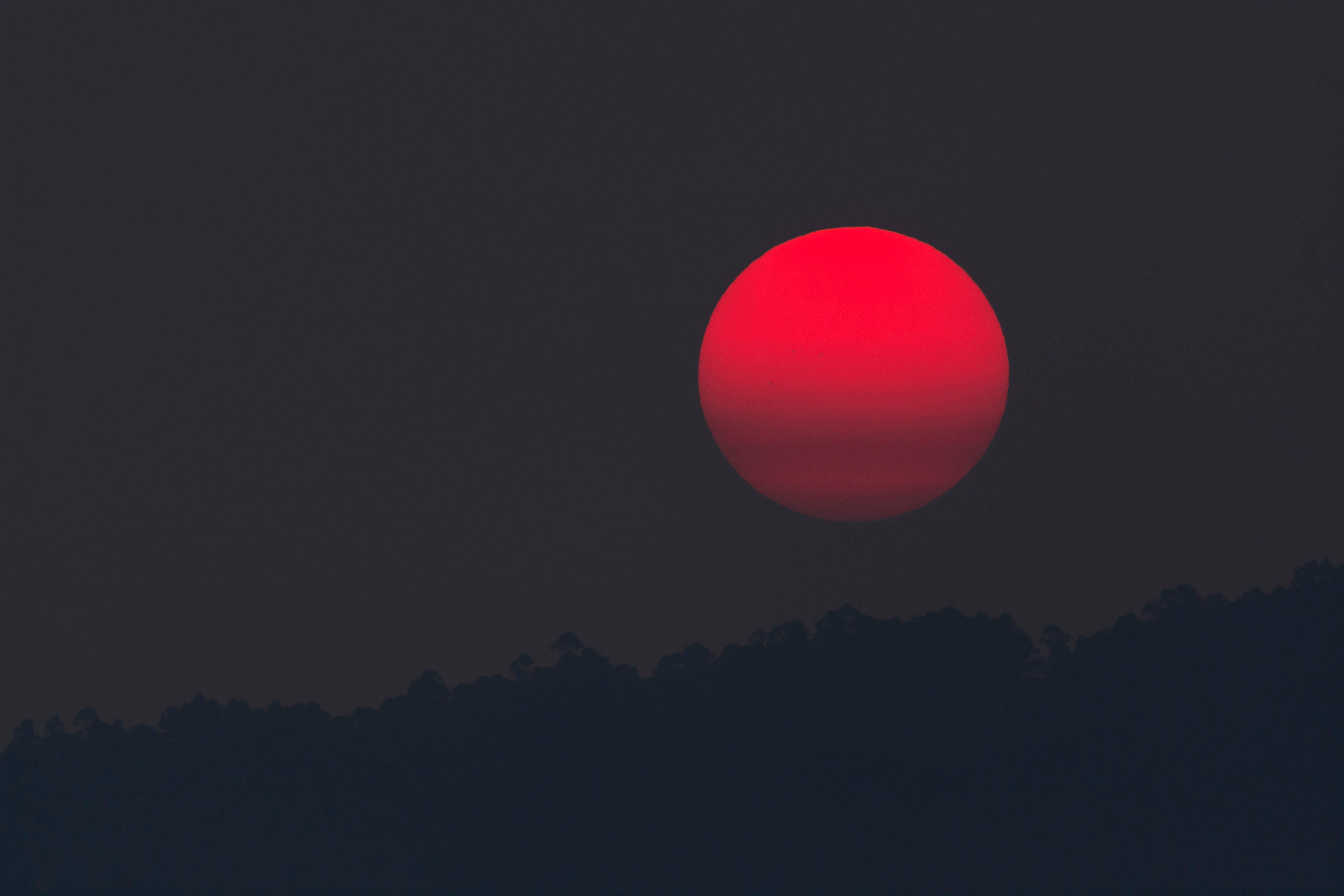 Red Moon Light Shining Through the Black Screen — 6000x4000 wallpaper