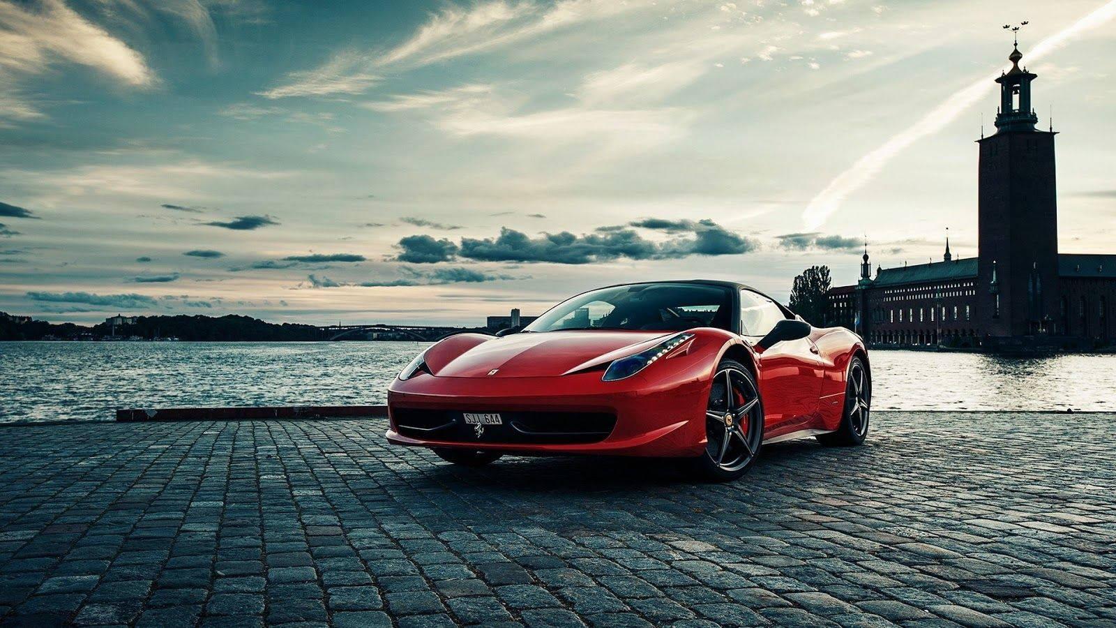 Red sports car against a black and white backdrop — 1600x900 wallpaper