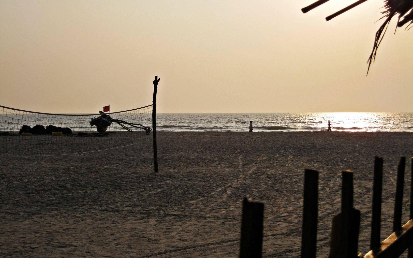 Relaxing on the beach at sunset — 1680x1050 wallpaper