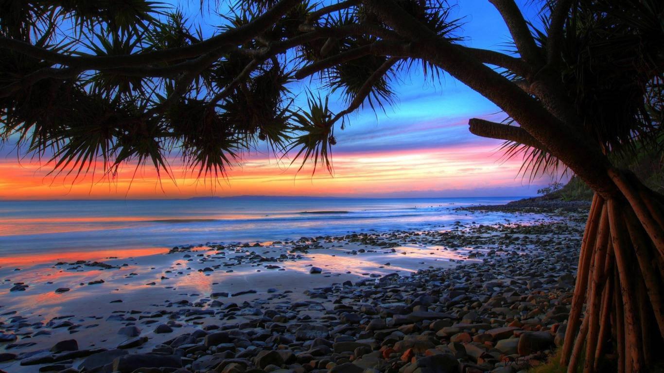Rocky Beach Sunset Laptop — 1366x768 wallpaper