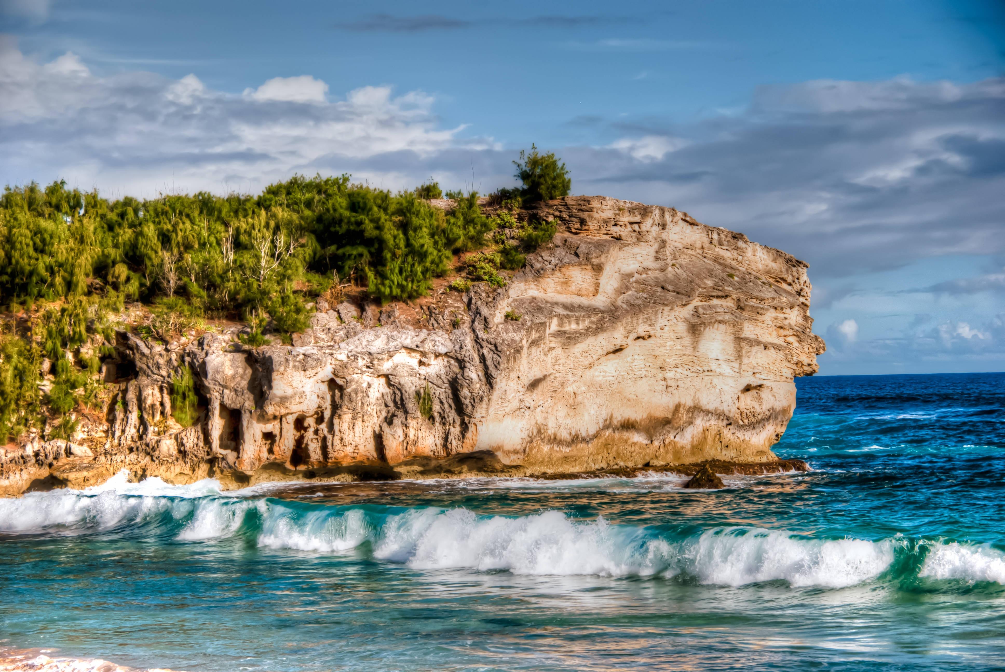 Rocky Cliff and Sandy Beach — 3872x2592 wallpaper